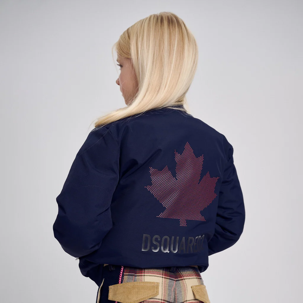 A blonde girl wearing a Dsquared2 jacket