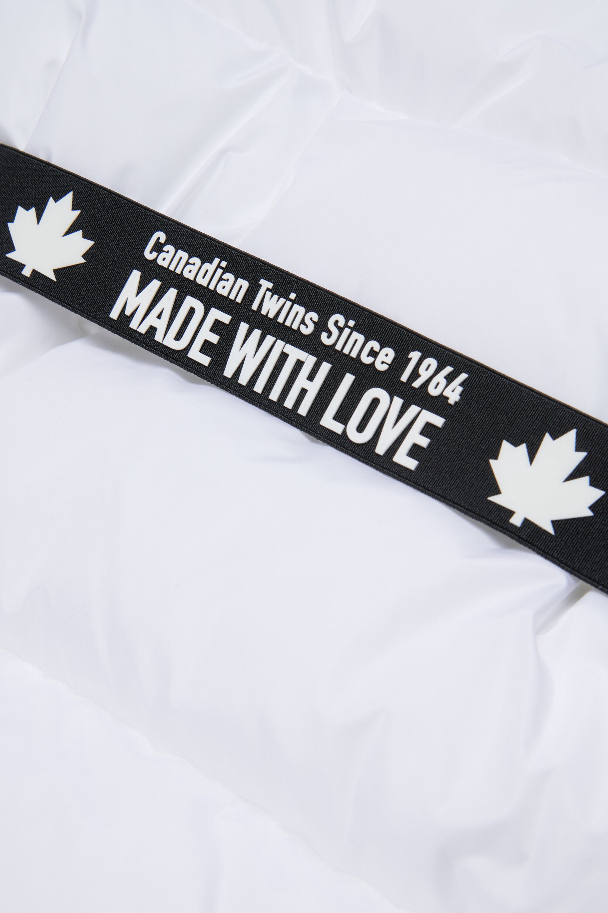 Long padded jacket with branded belt