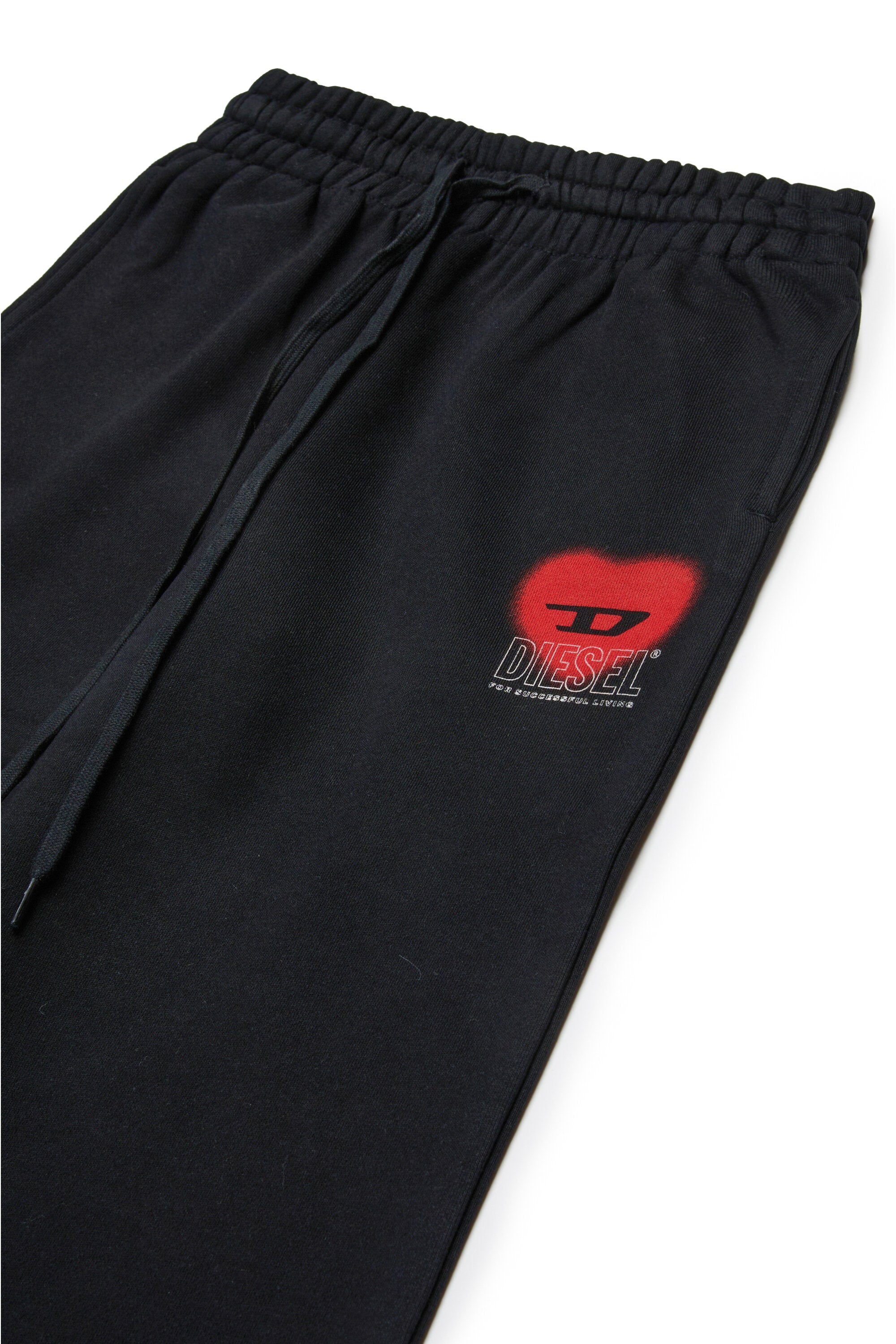 Pantalones de felpa con gráficos de corazones