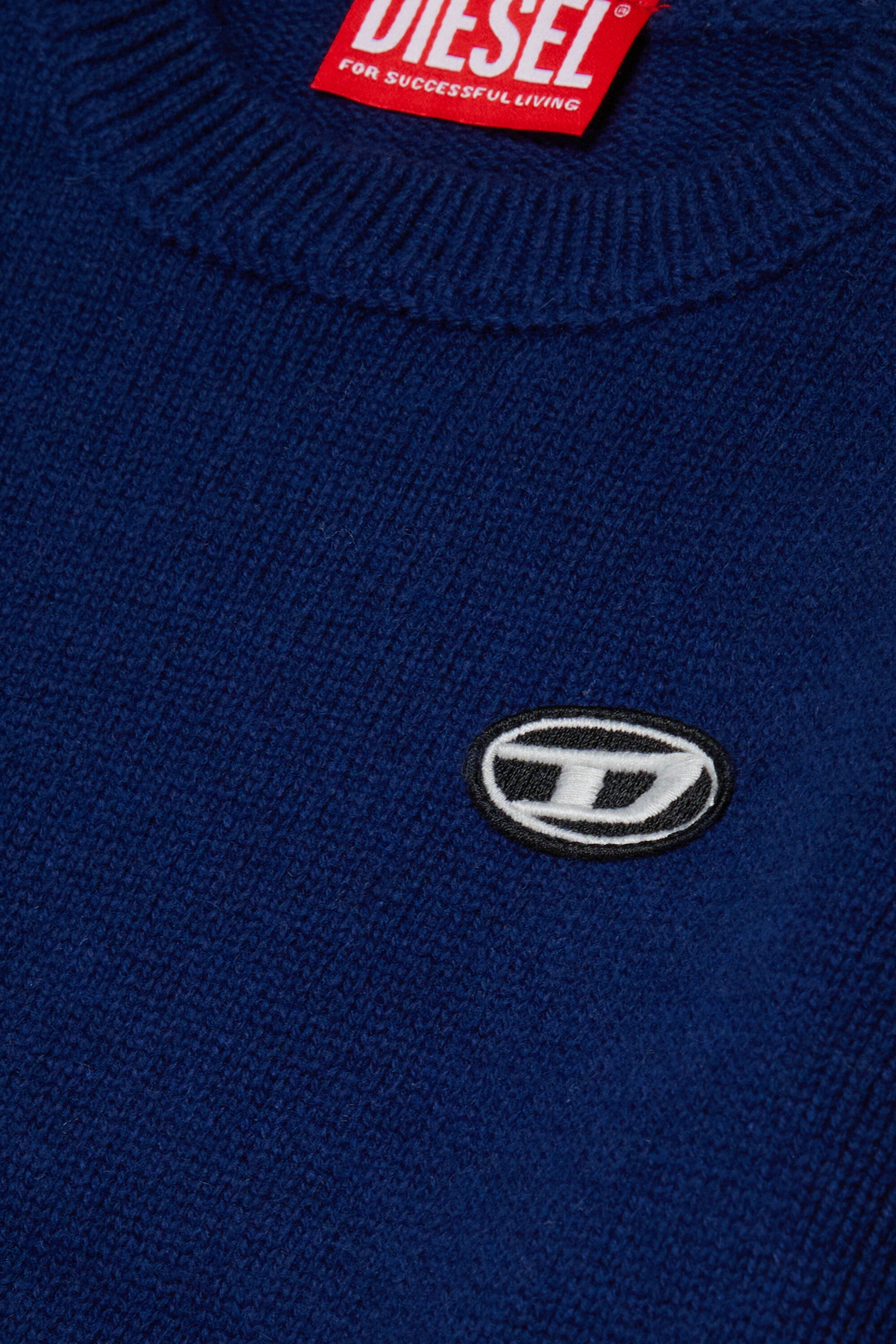 Pullover aus Wolle und Kaschmir mit Patches