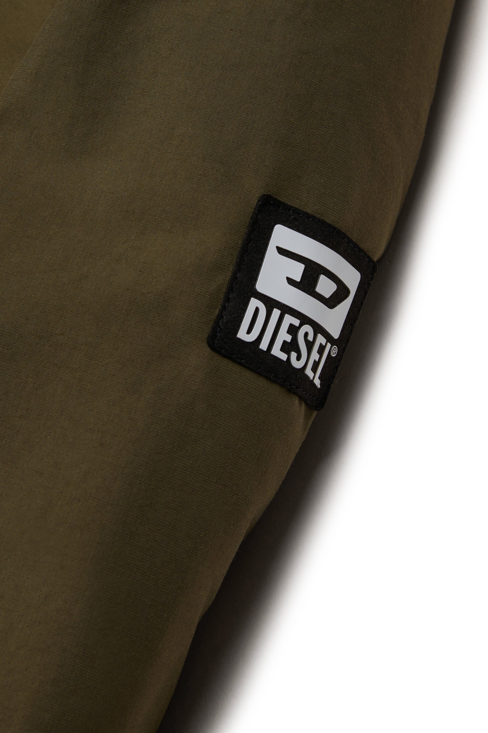 Veste matelassée avec capuche en fausse fourrure