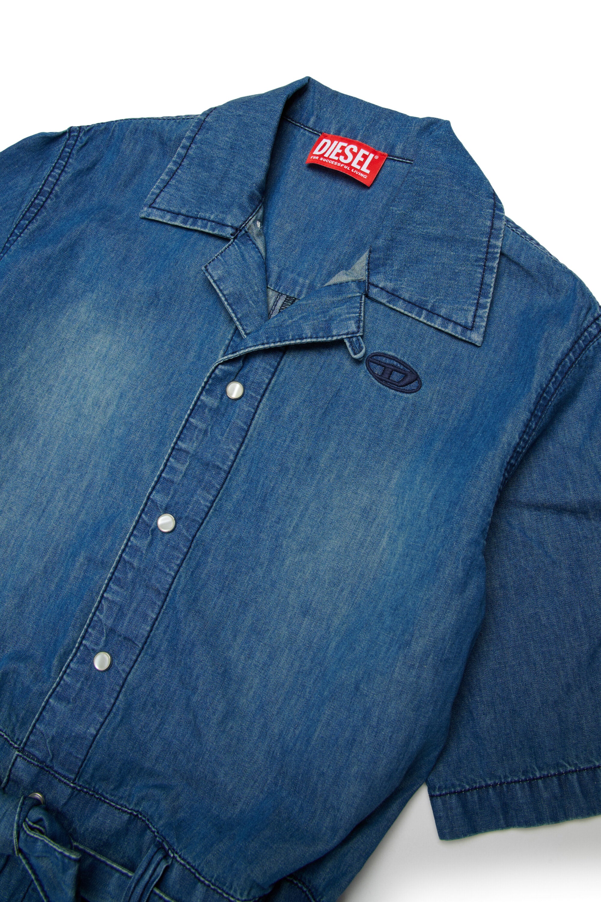 Tuta corta in denim con logo