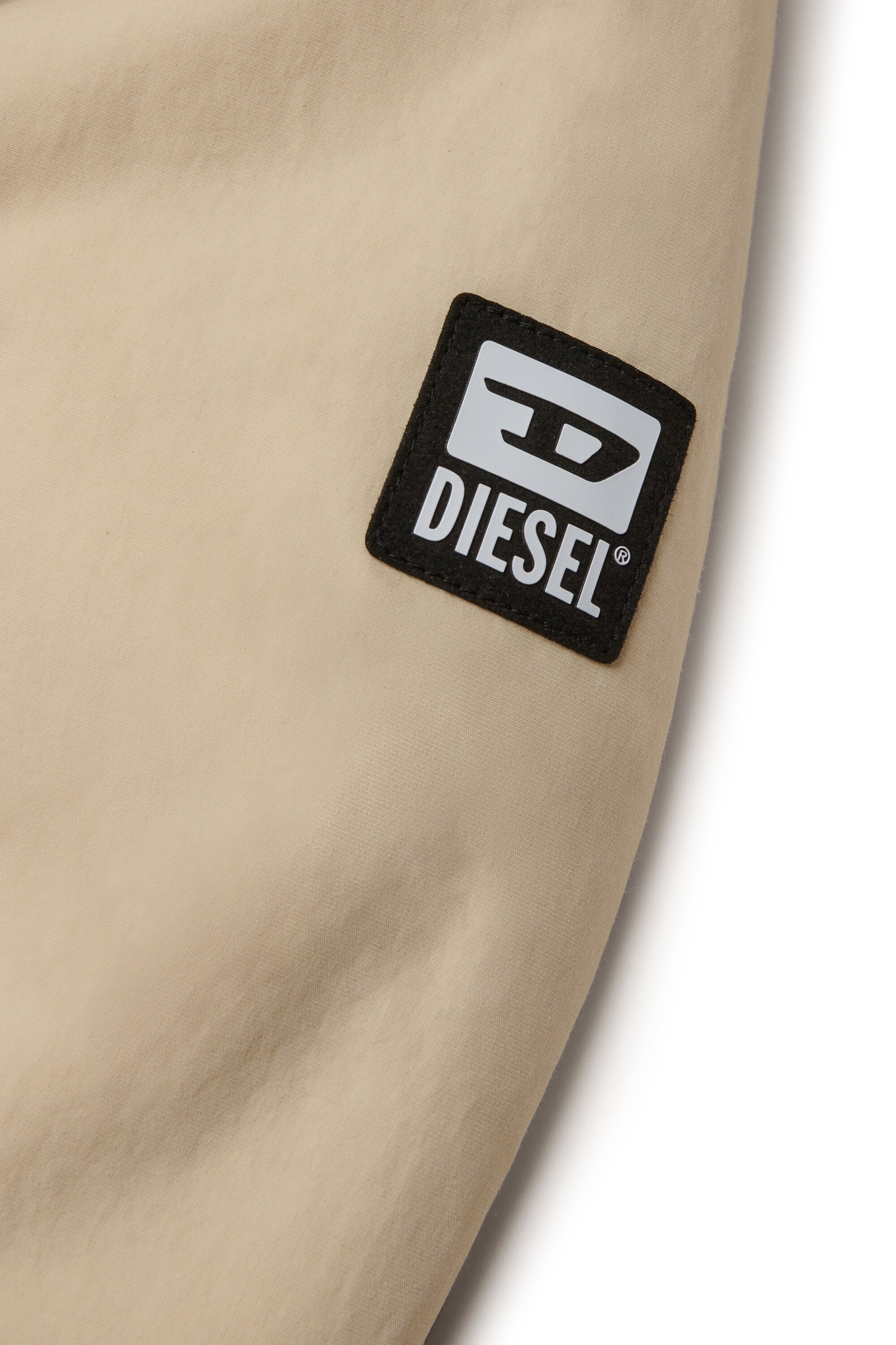 Chaqueta acolchada con capucha de piel sintética y bolsillos