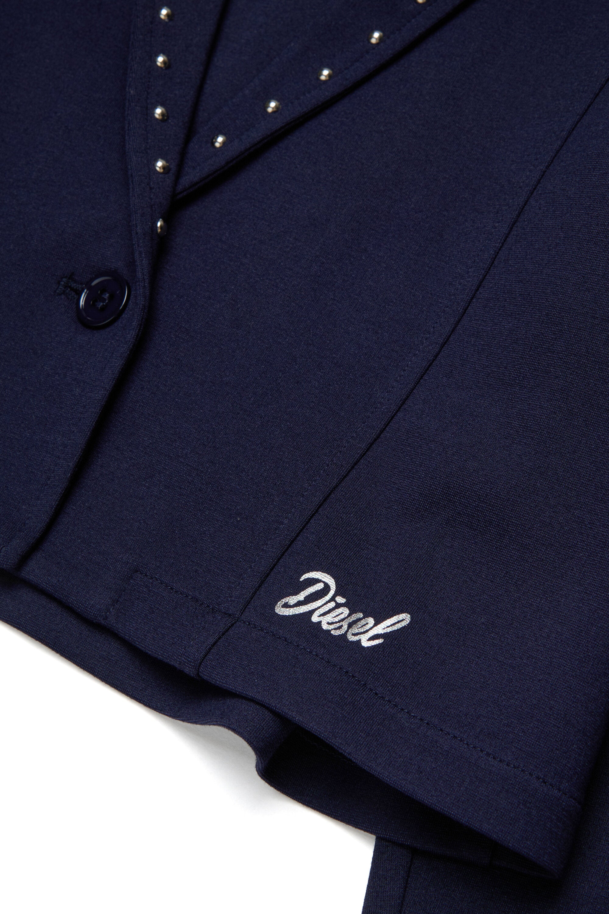 Blazer con borchie e logo