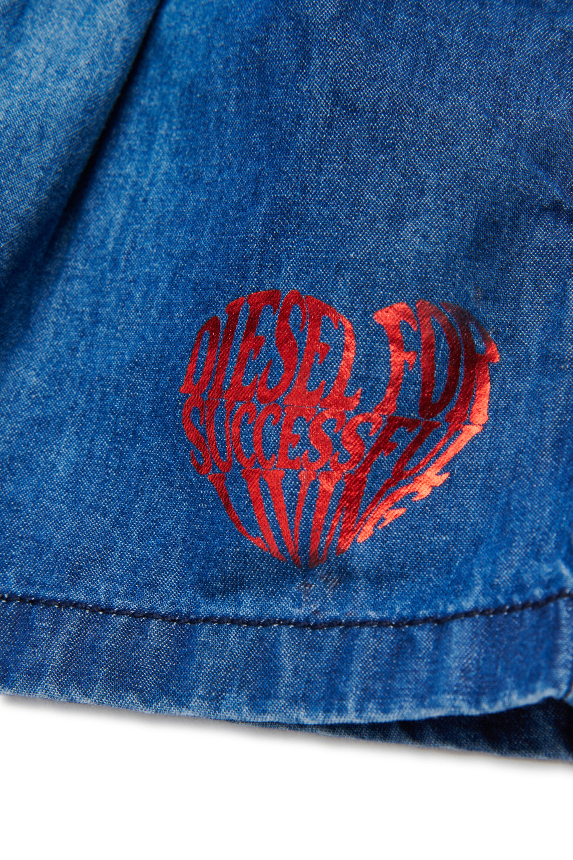 Shorts denim con logo stampato