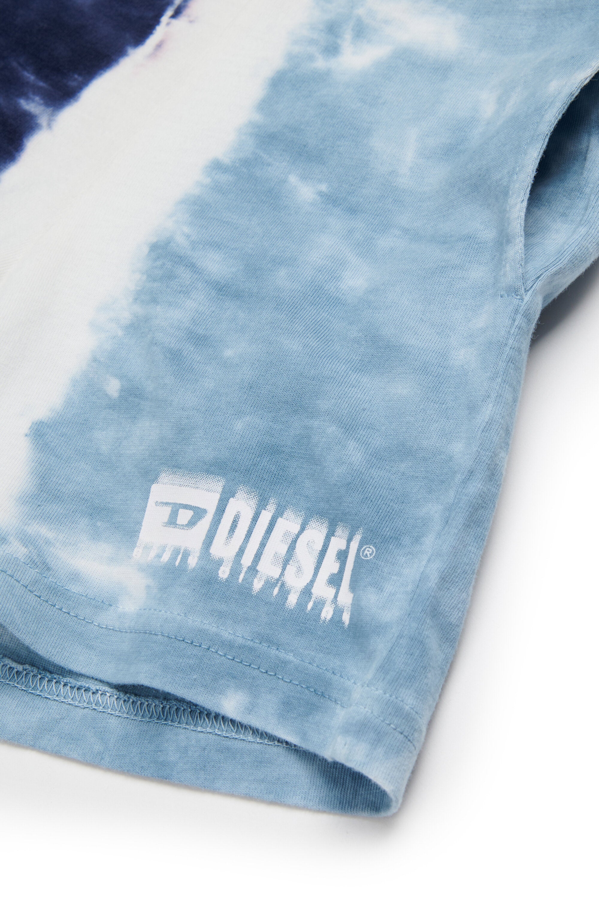 Tuta effetto sfumato con logo degradé