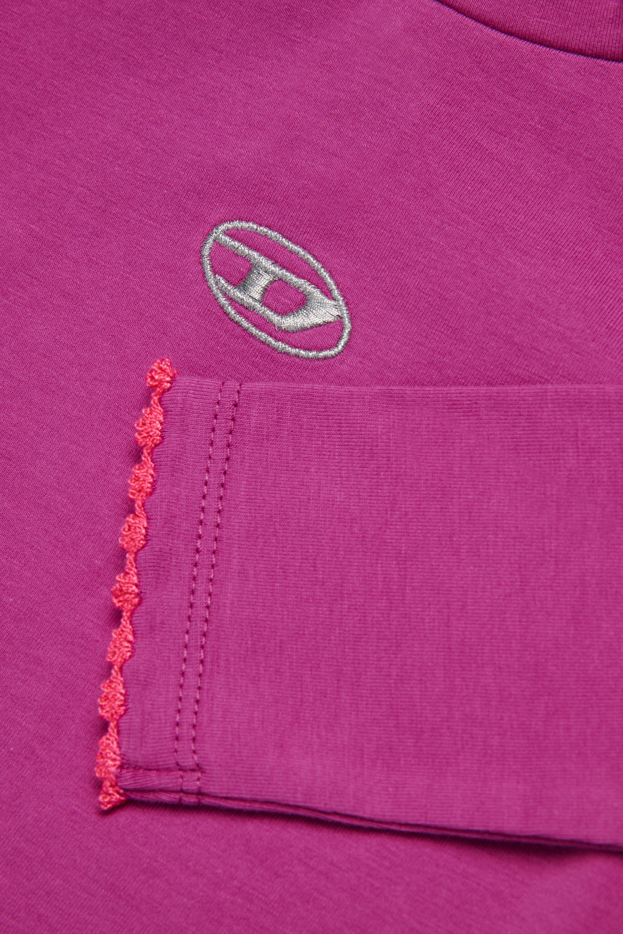 Col roulé en jersey extensible avec logo en lurex Oval D.