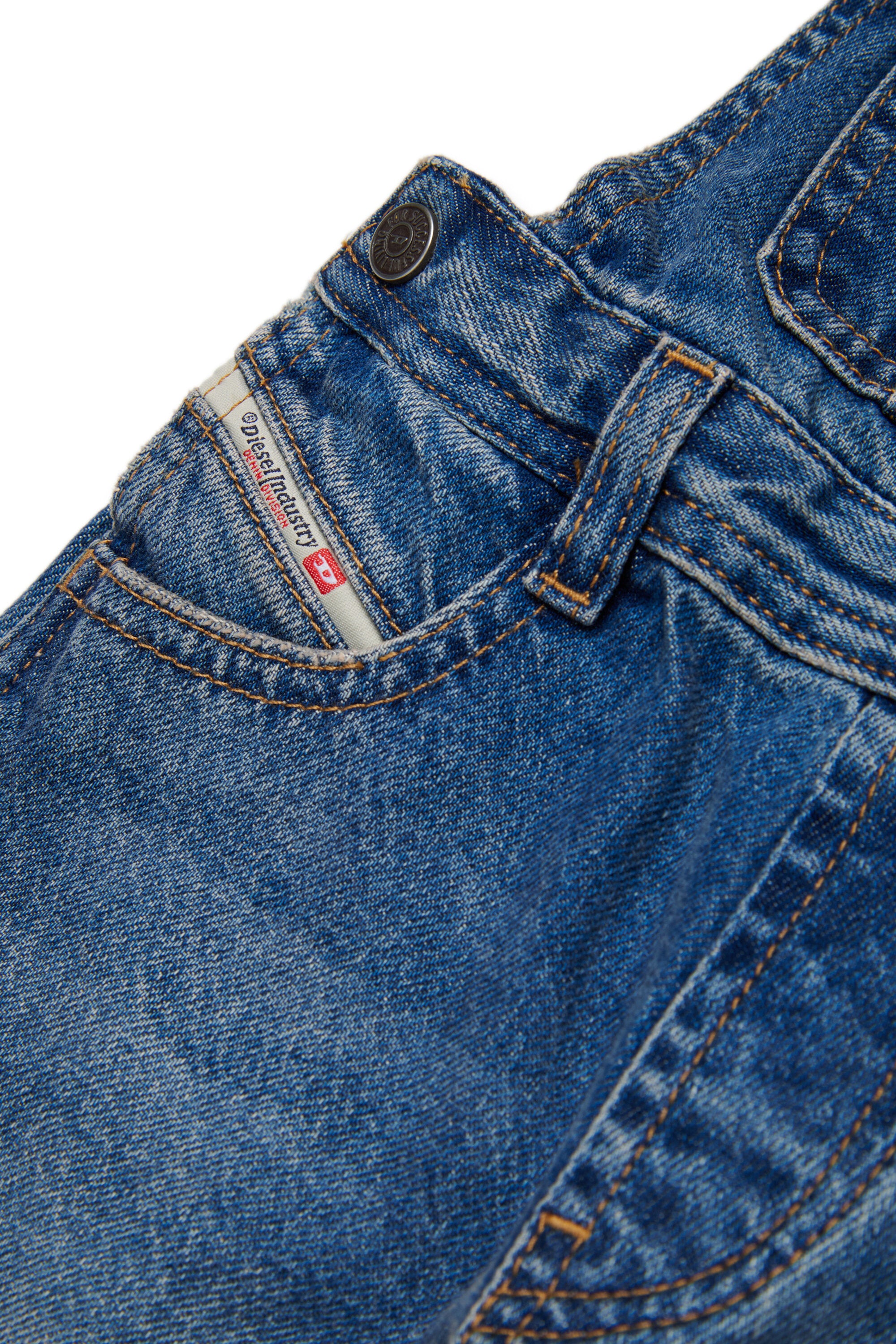 Salopette de denim con logo