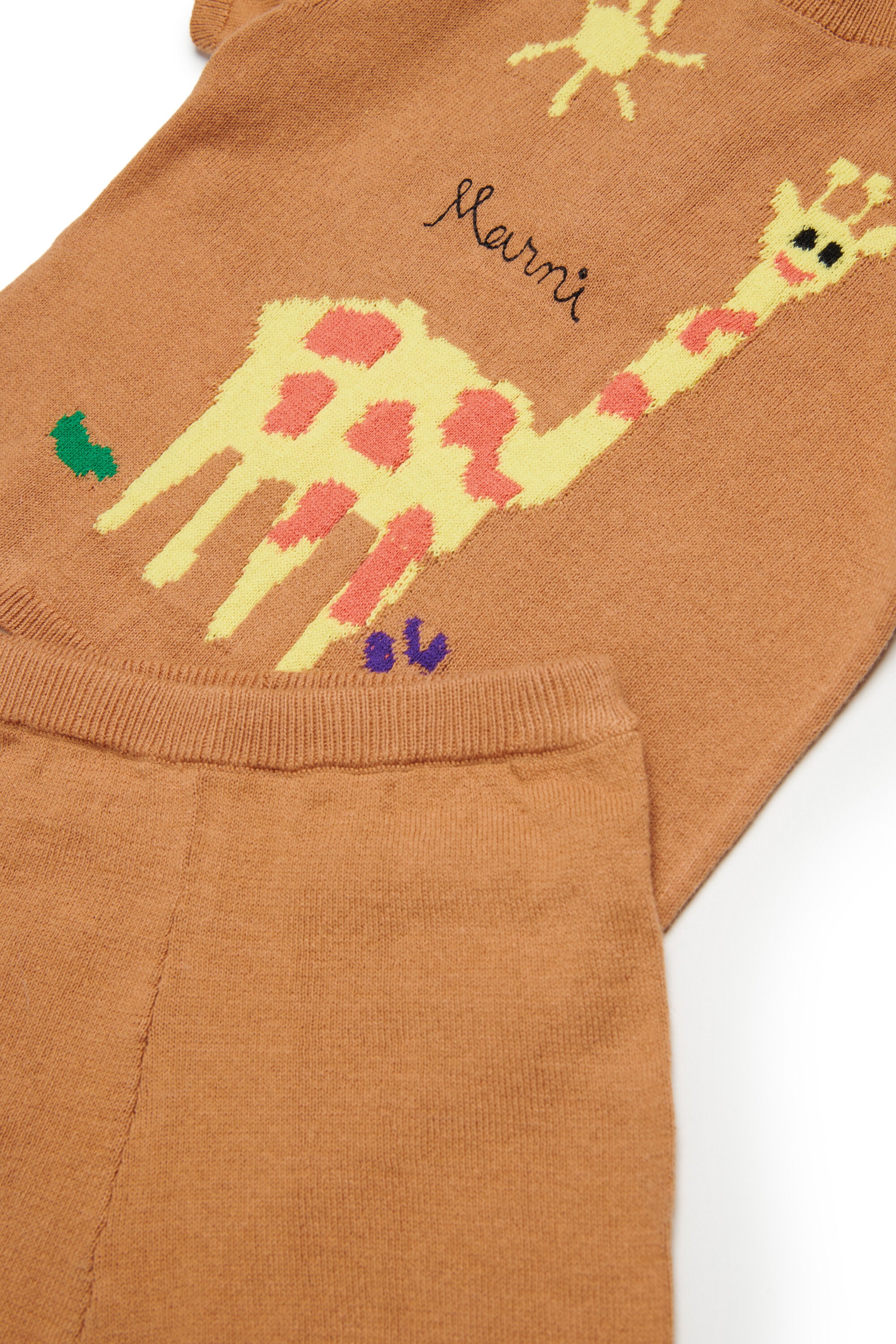 Baby jumpsuit with giraffe in jacquard fabric