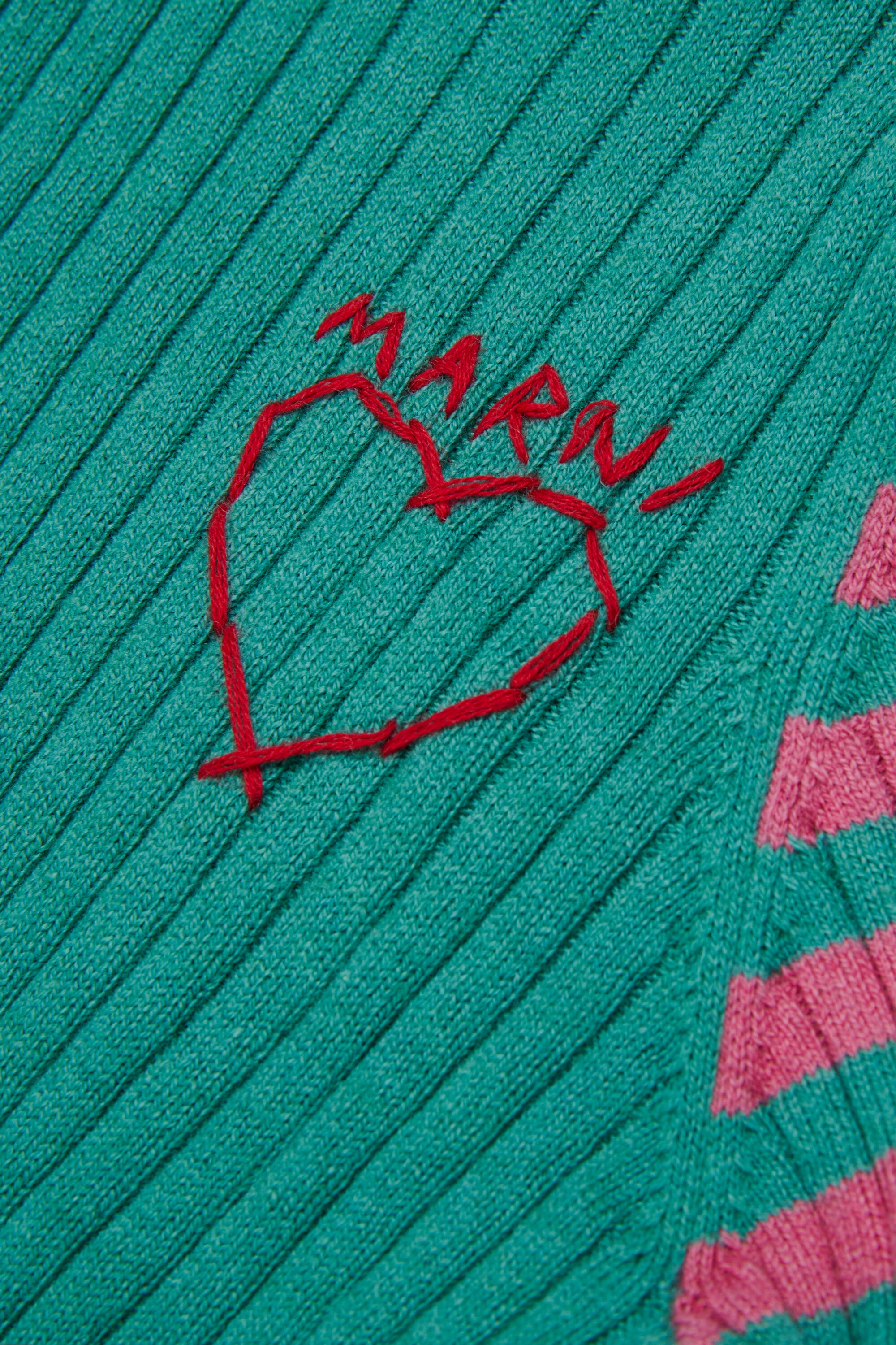 Ribbed turtleneck with heart pattern