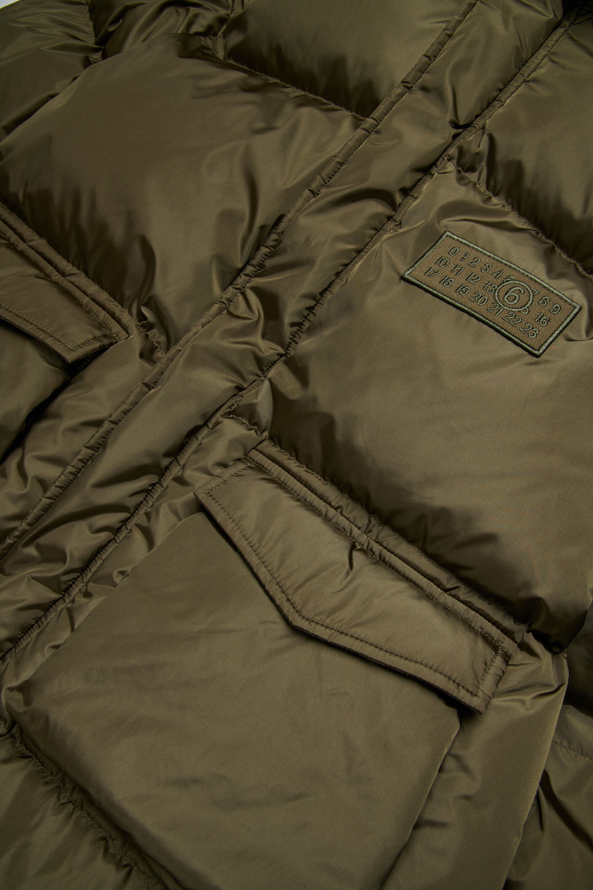 Longue veste matelassée avec poches