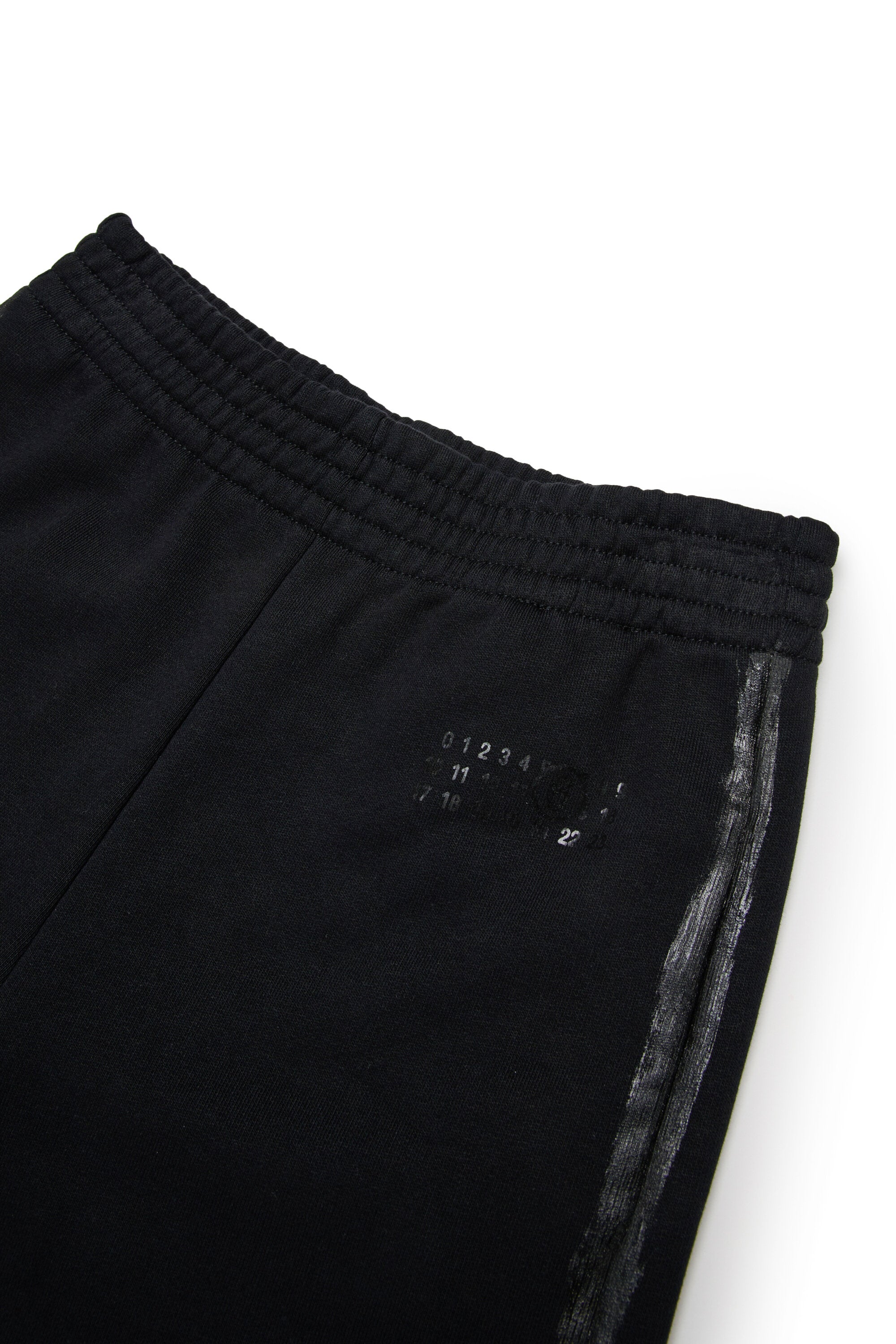 Pantaloni in felpa con spennellature lucide