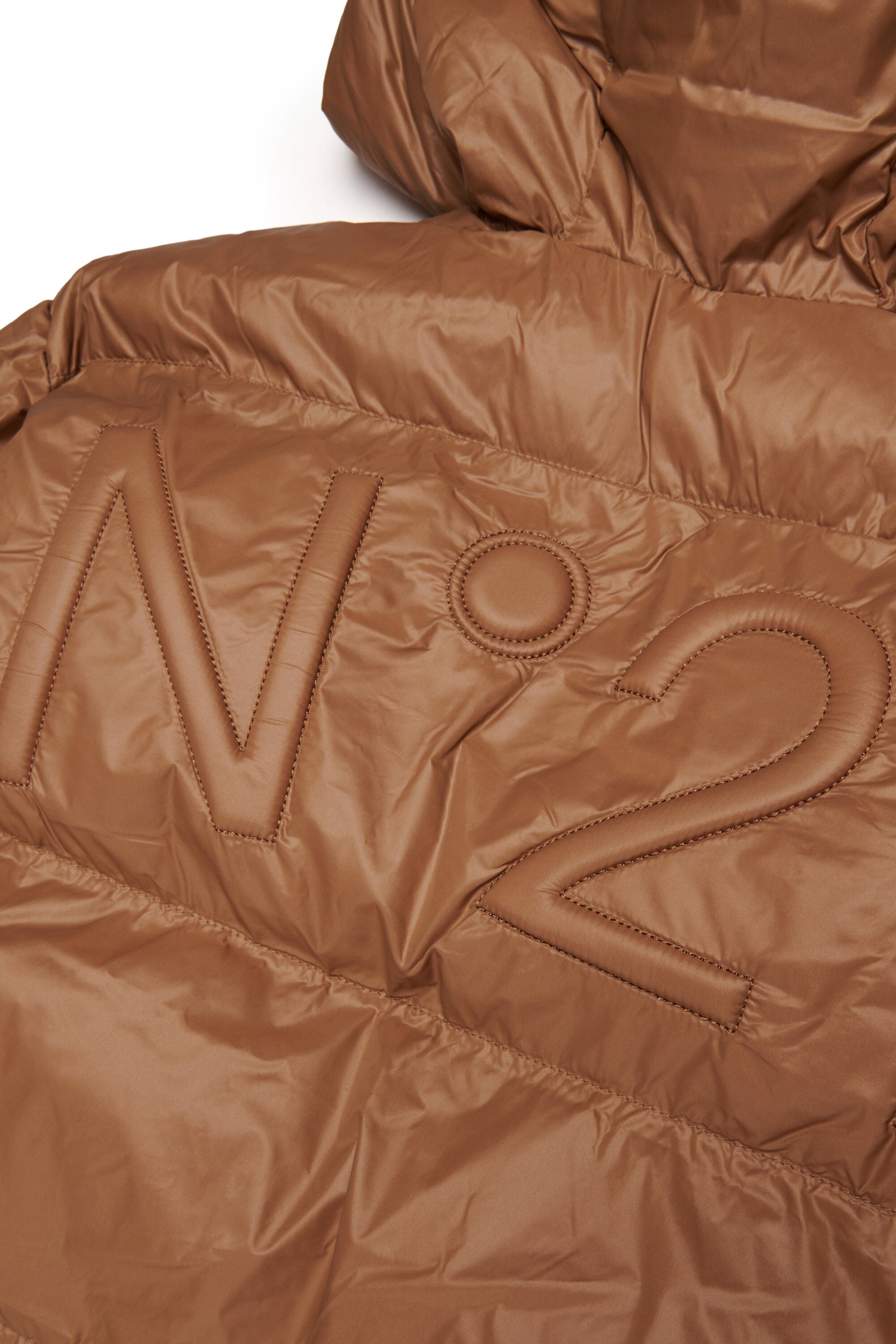 Veste courte et matelassée à fond asymétrique