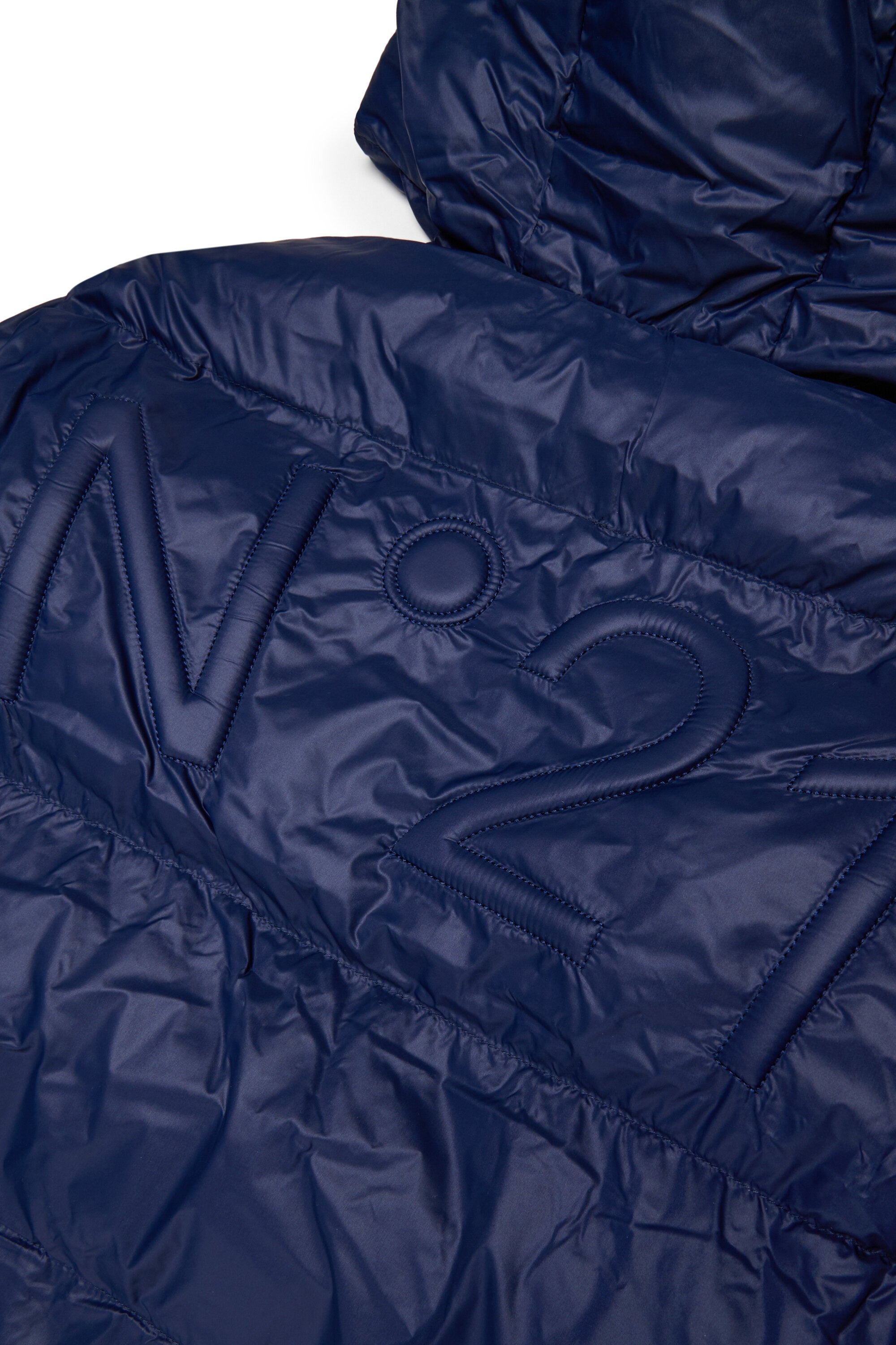 Veste courte et matelassée à fond asymétrique