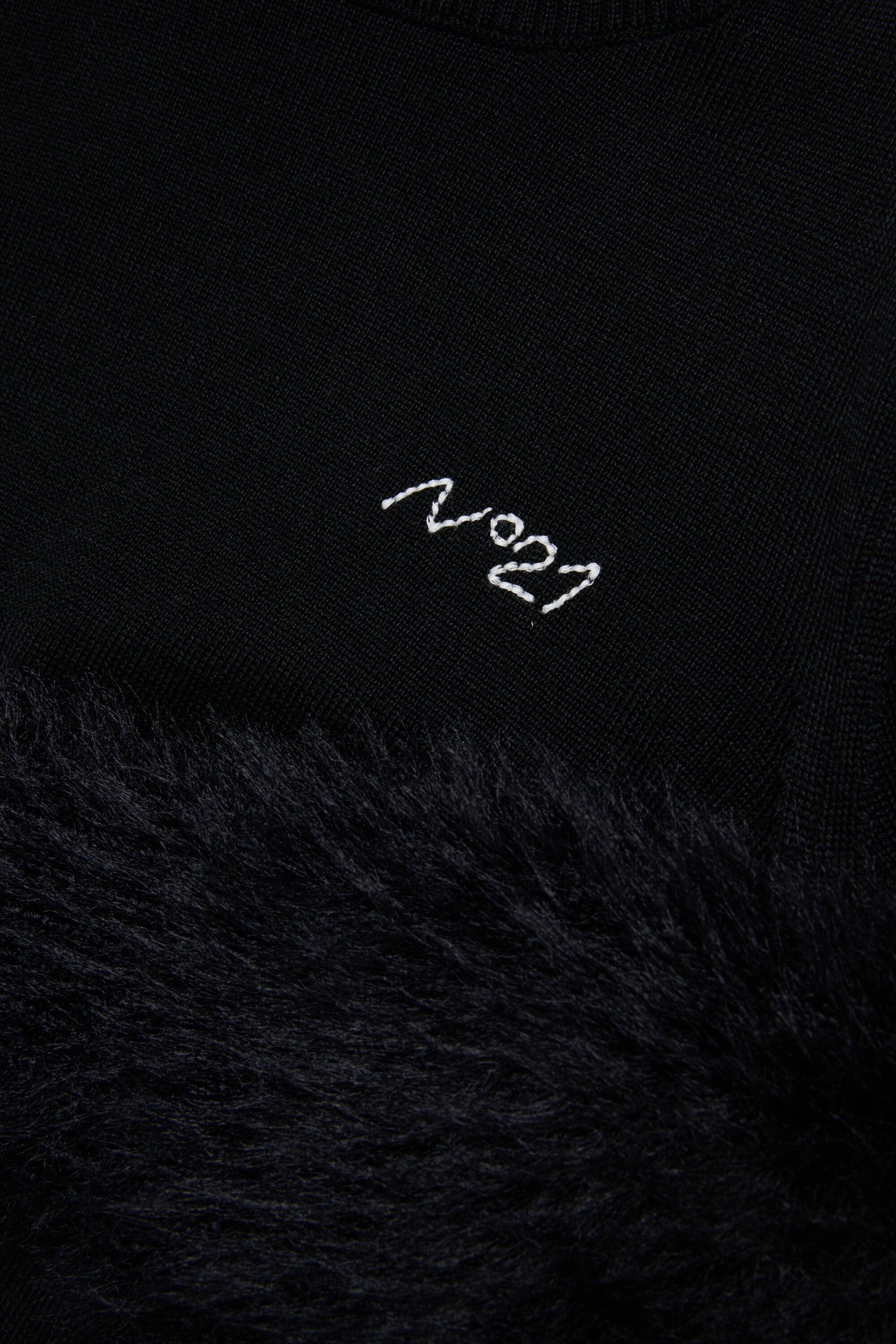 Col roulé en laine avec fausse fourrure sur les manches