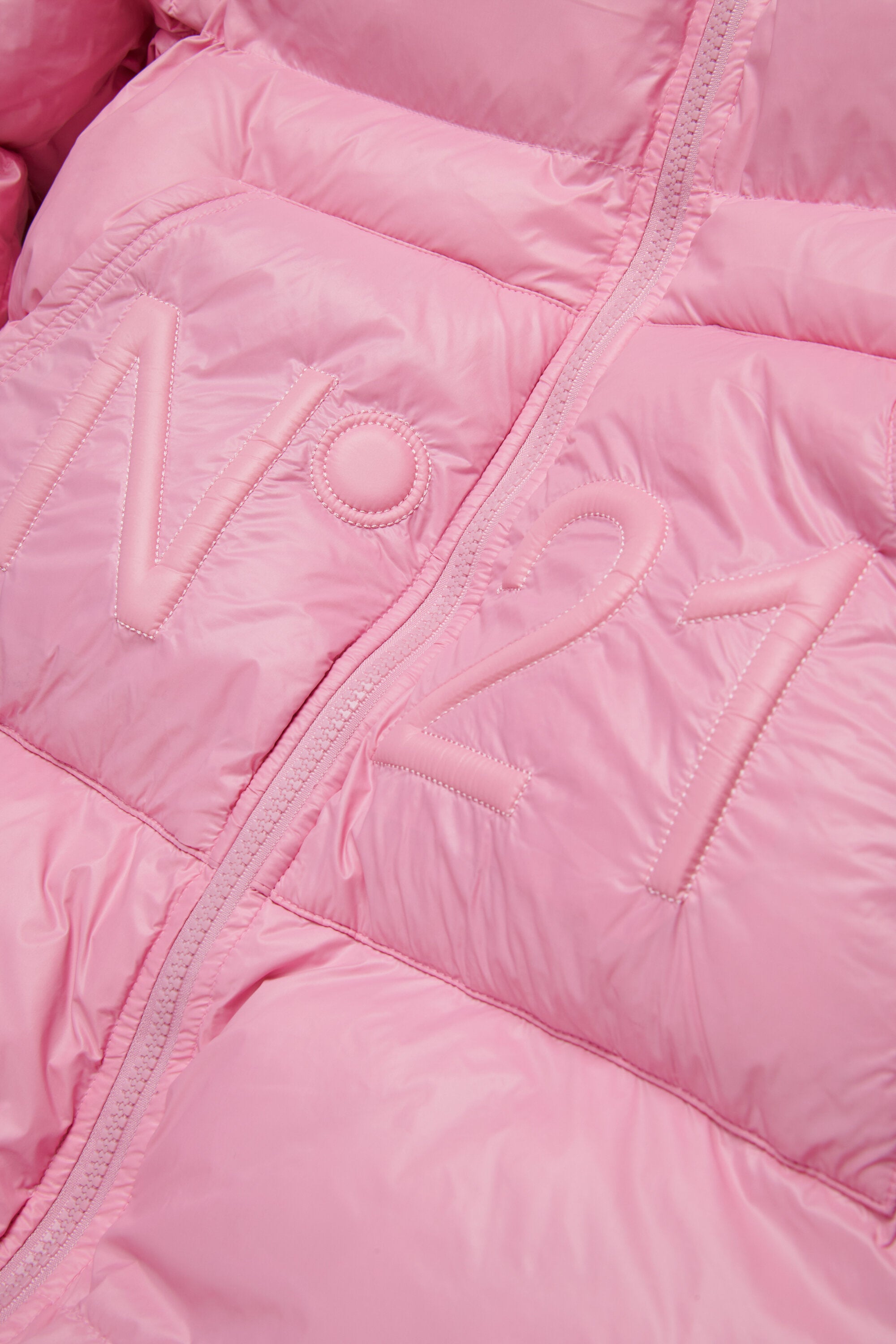 Longue veste matelassée à fond asymétrique