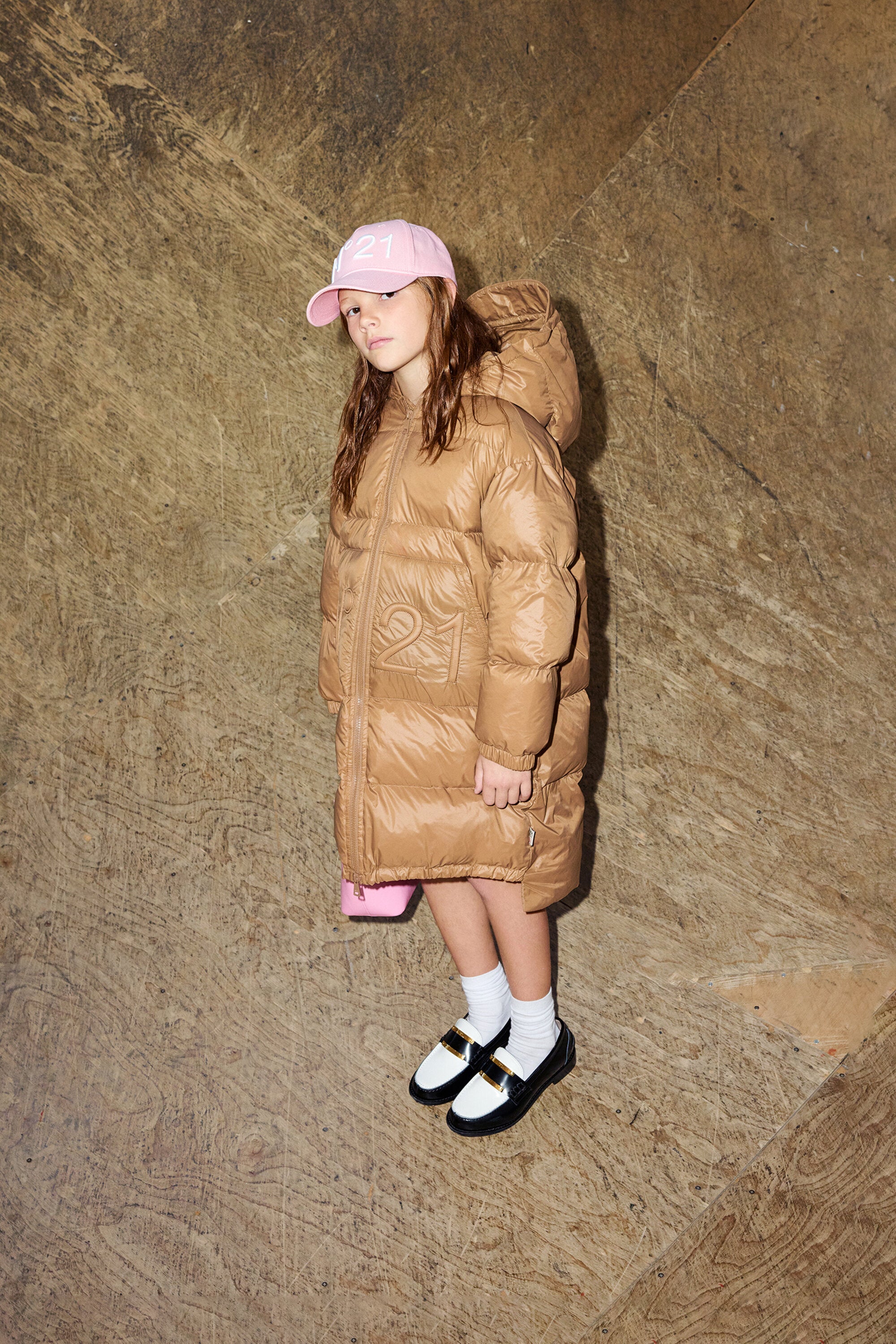 Long padded jacket with asymmetrical bottom