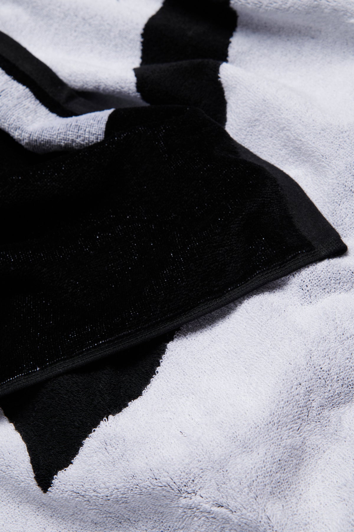 Black terry beach towel with maxi-logo