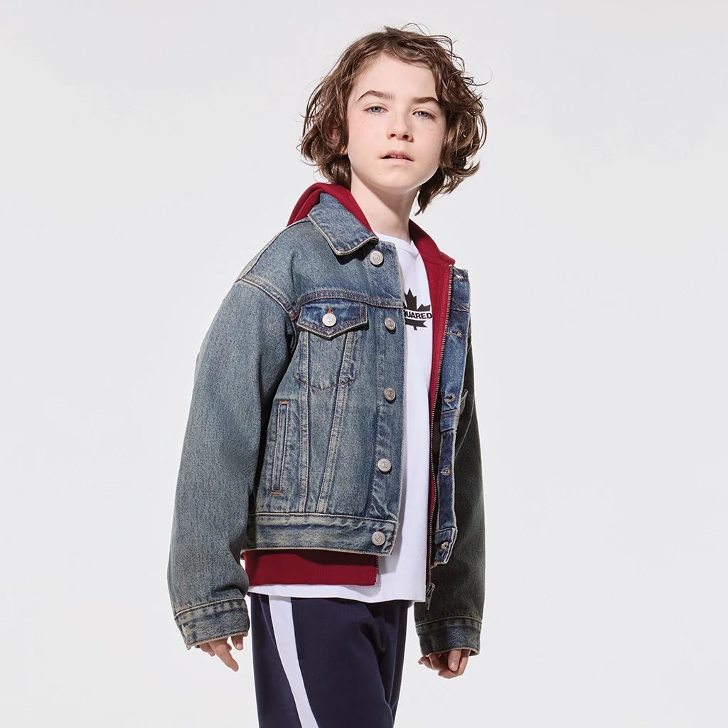 Jackets category - A boy smiling with a black jacket and a red background