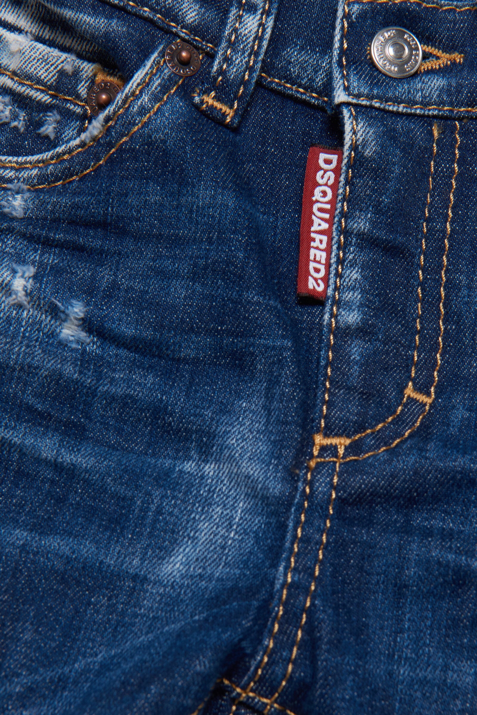 Shaded dark blue jeans with abrasions