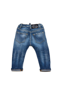 Medium blue jeans shaded with abrasions
