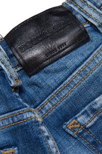 Medium blue jeans shaded with abrasions