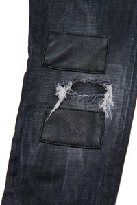 Slim straight black jeans shaded with leather patch and spots