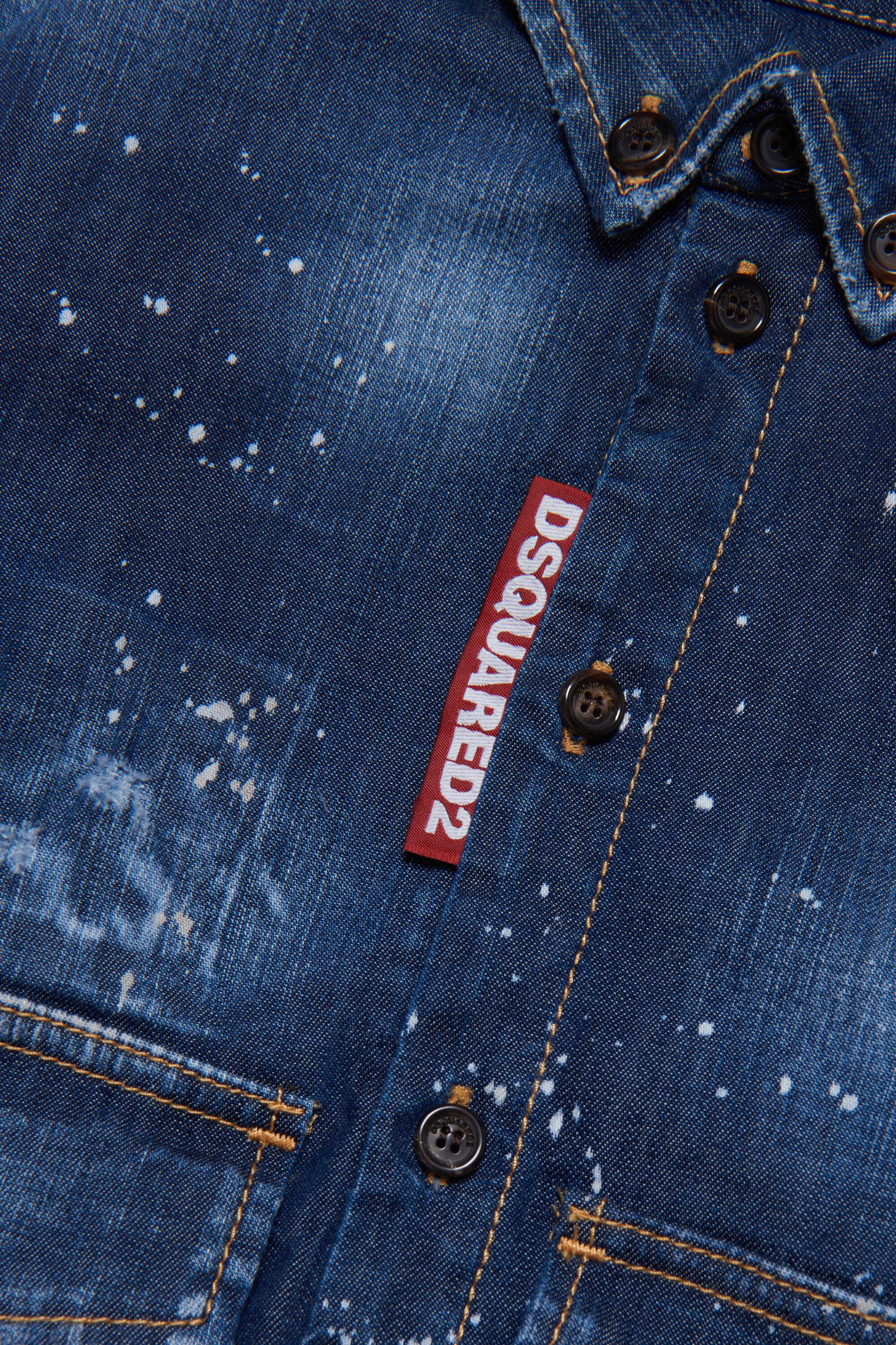 Shaded blue denim shirt with abrasions and stains