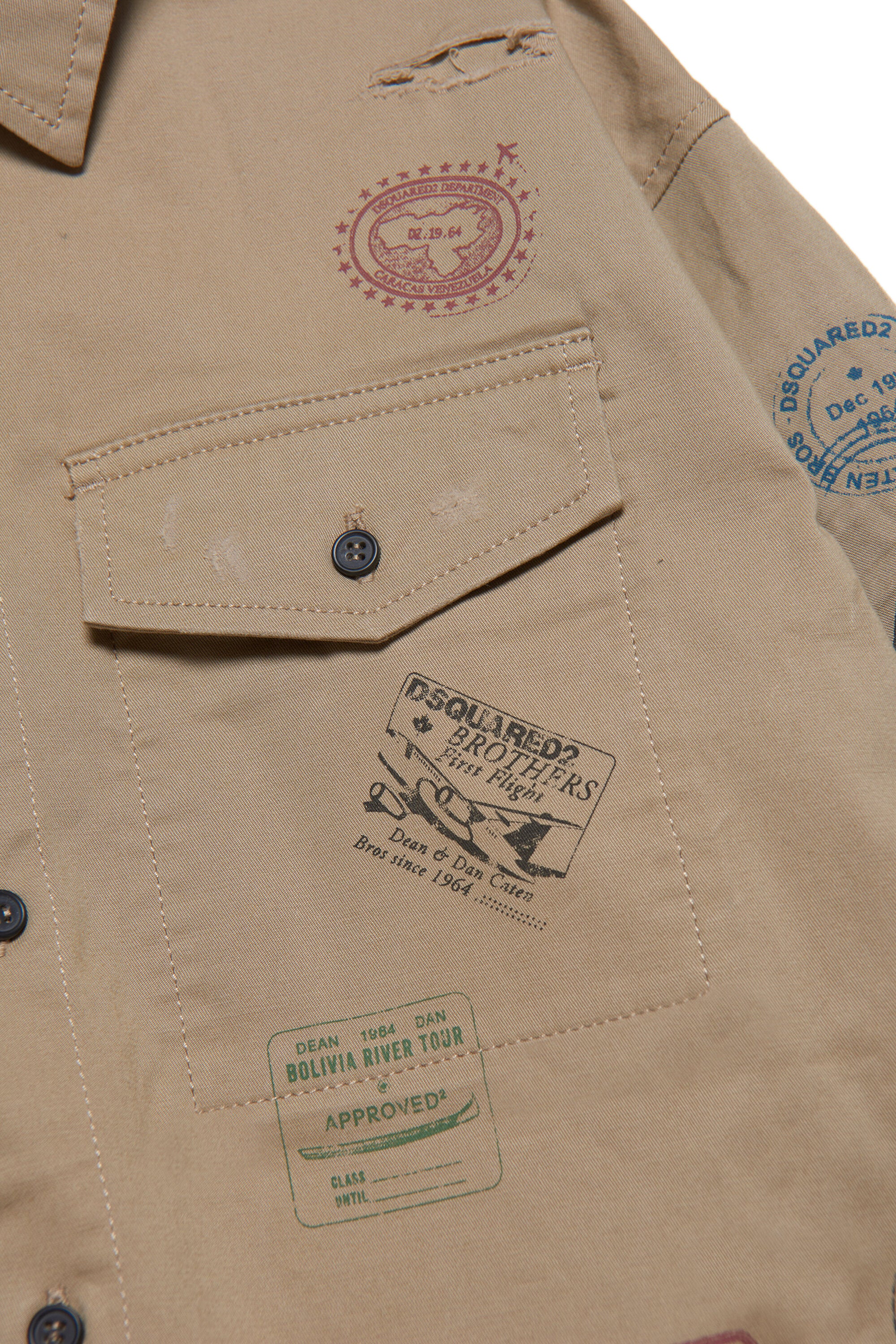 Gabardine shirt with tears and stamps