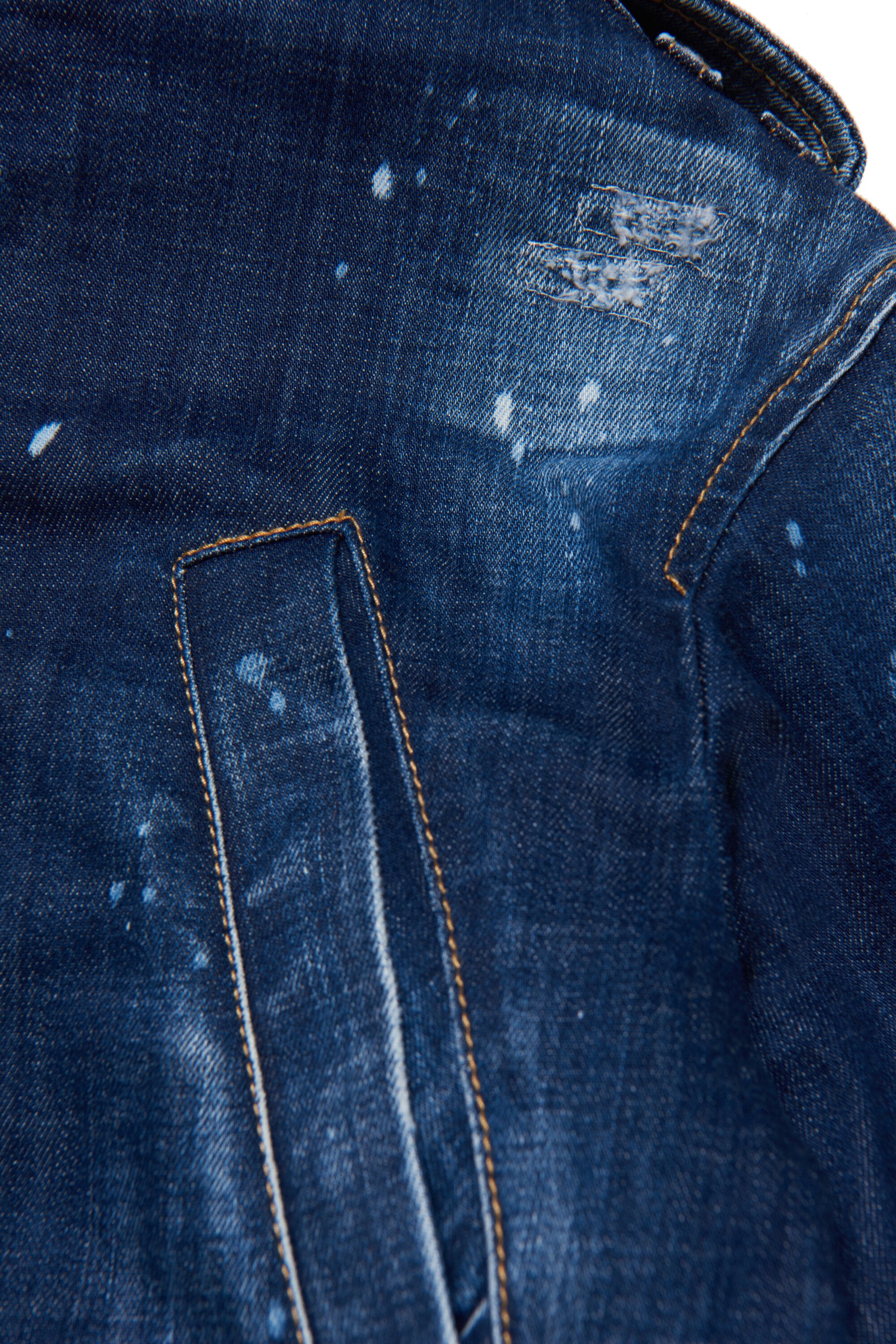 Shaded blue denim parka jacket with abrasions and stains