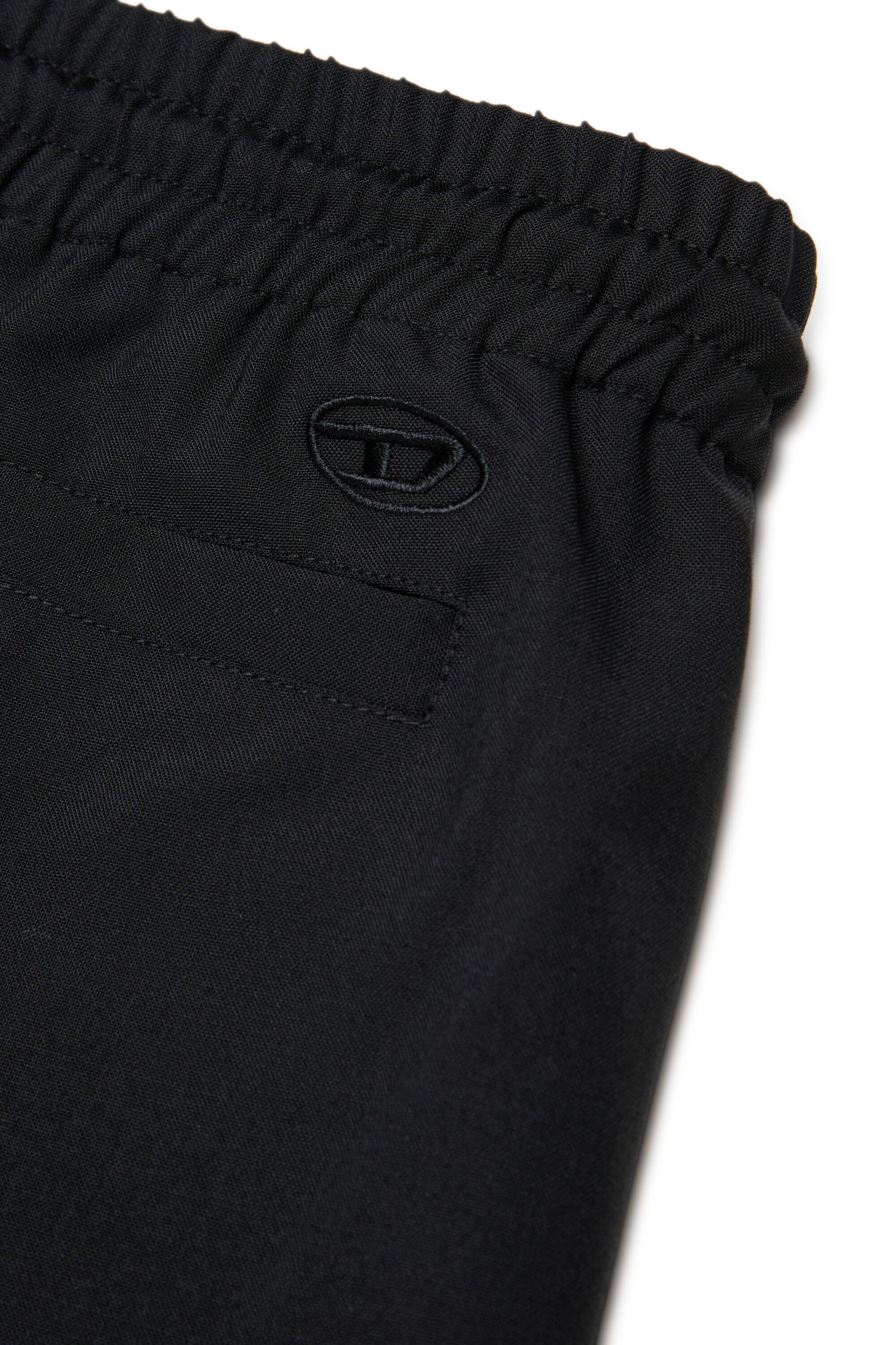 Pantalones formales con logo