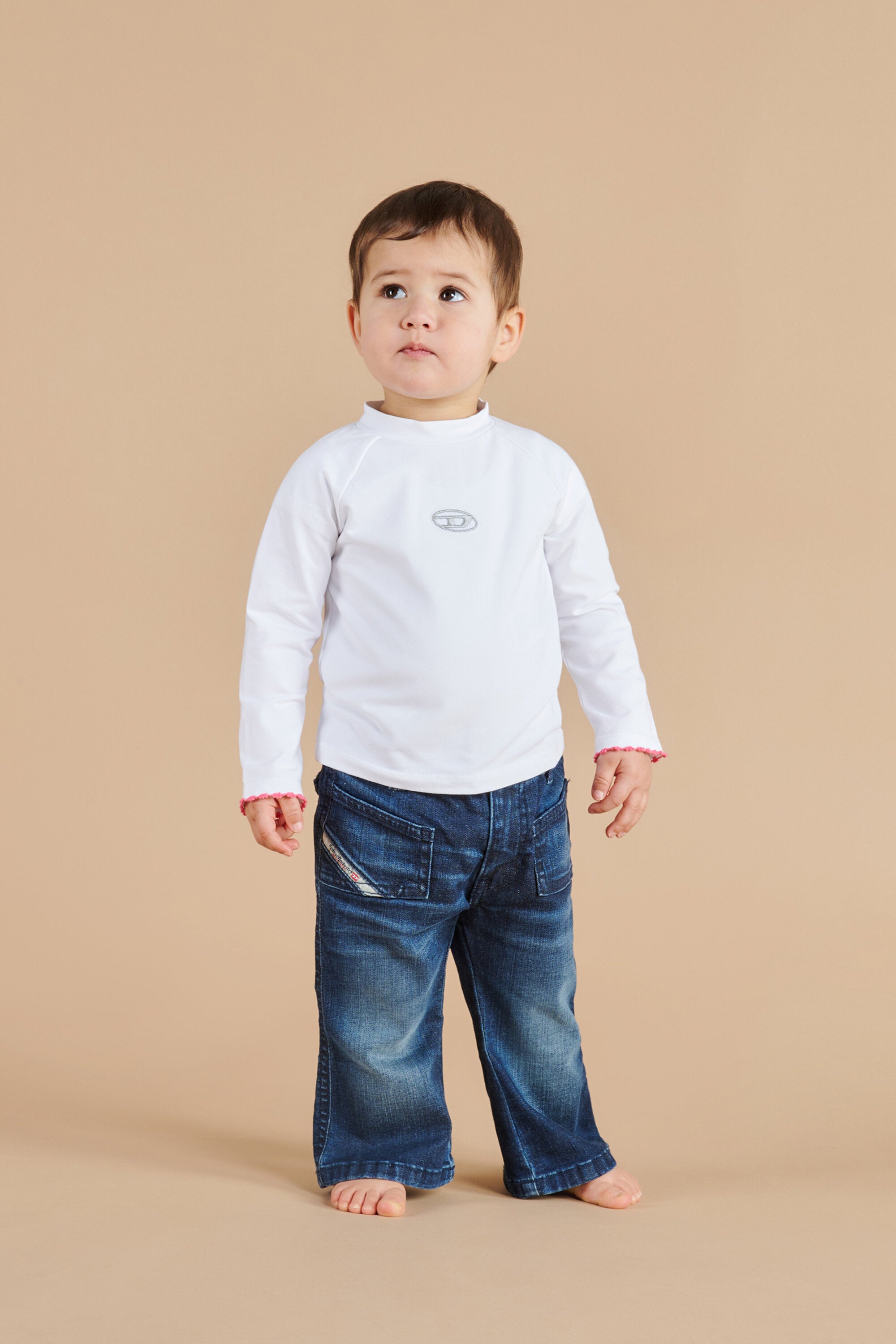 Dolcevita in jersey stretch con logo Oval D lurex