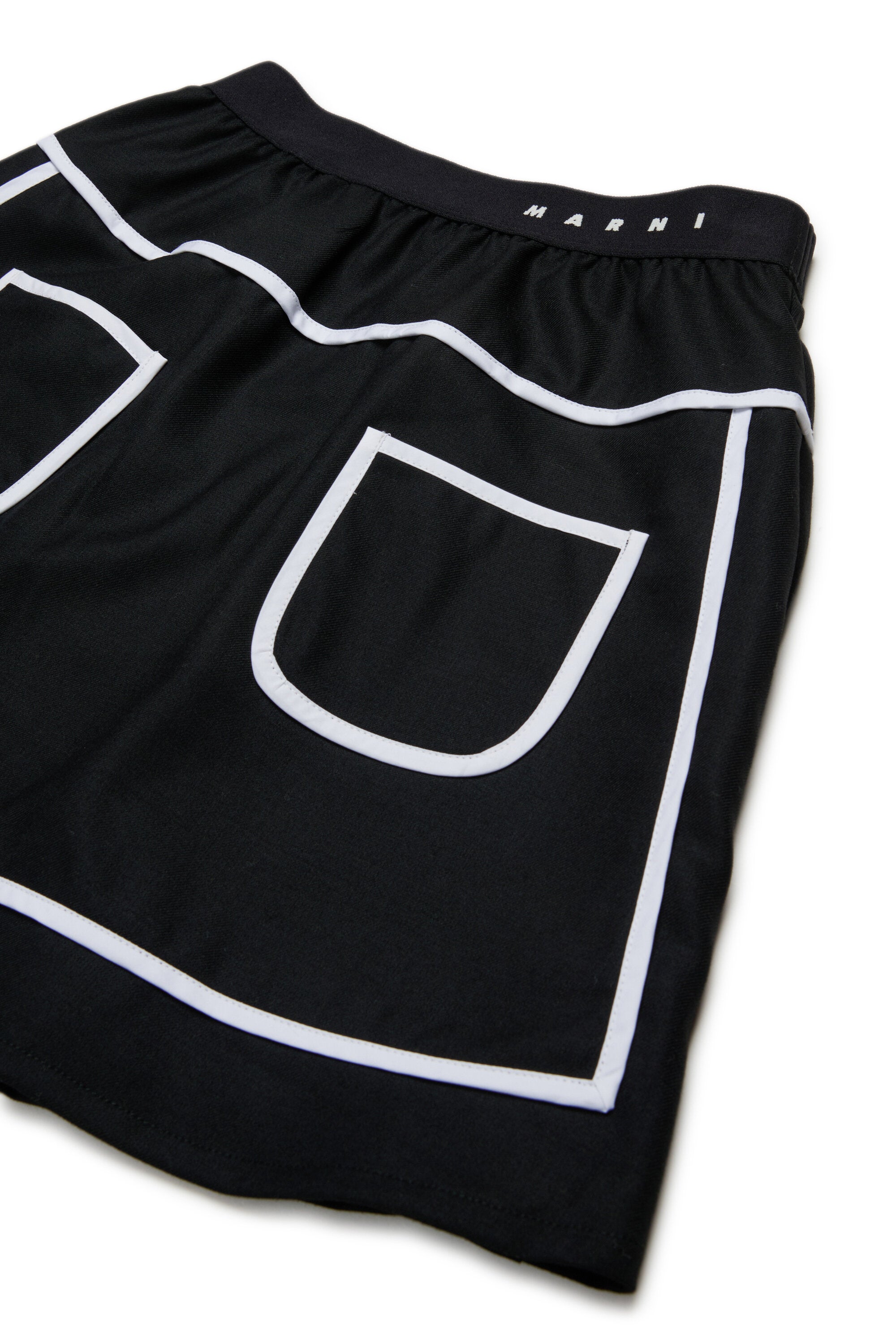 Gonna corta in flanella con bordino a contrasto