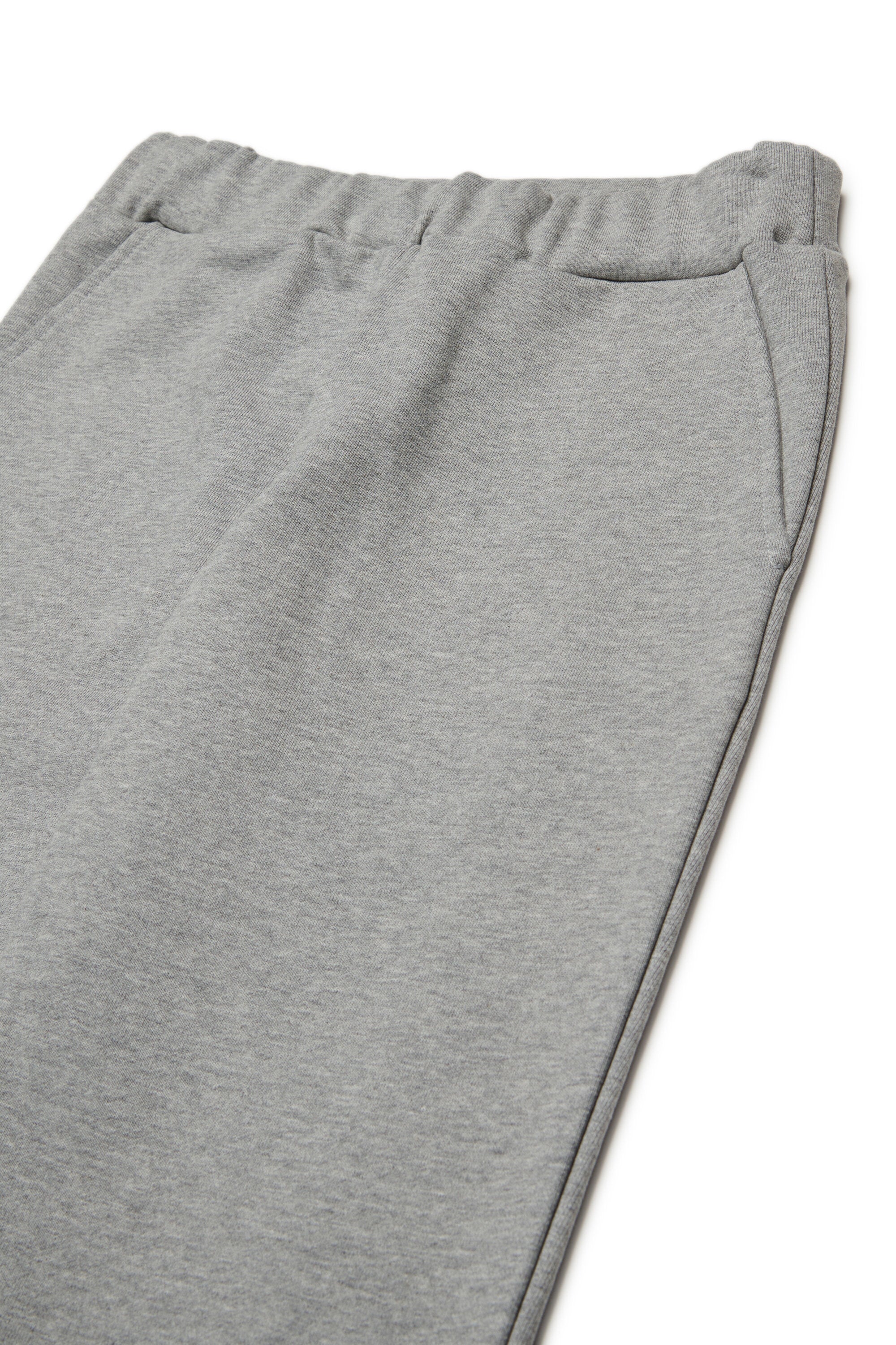 Pantalones deportivos de felpa con puños elásticos en los tobillos