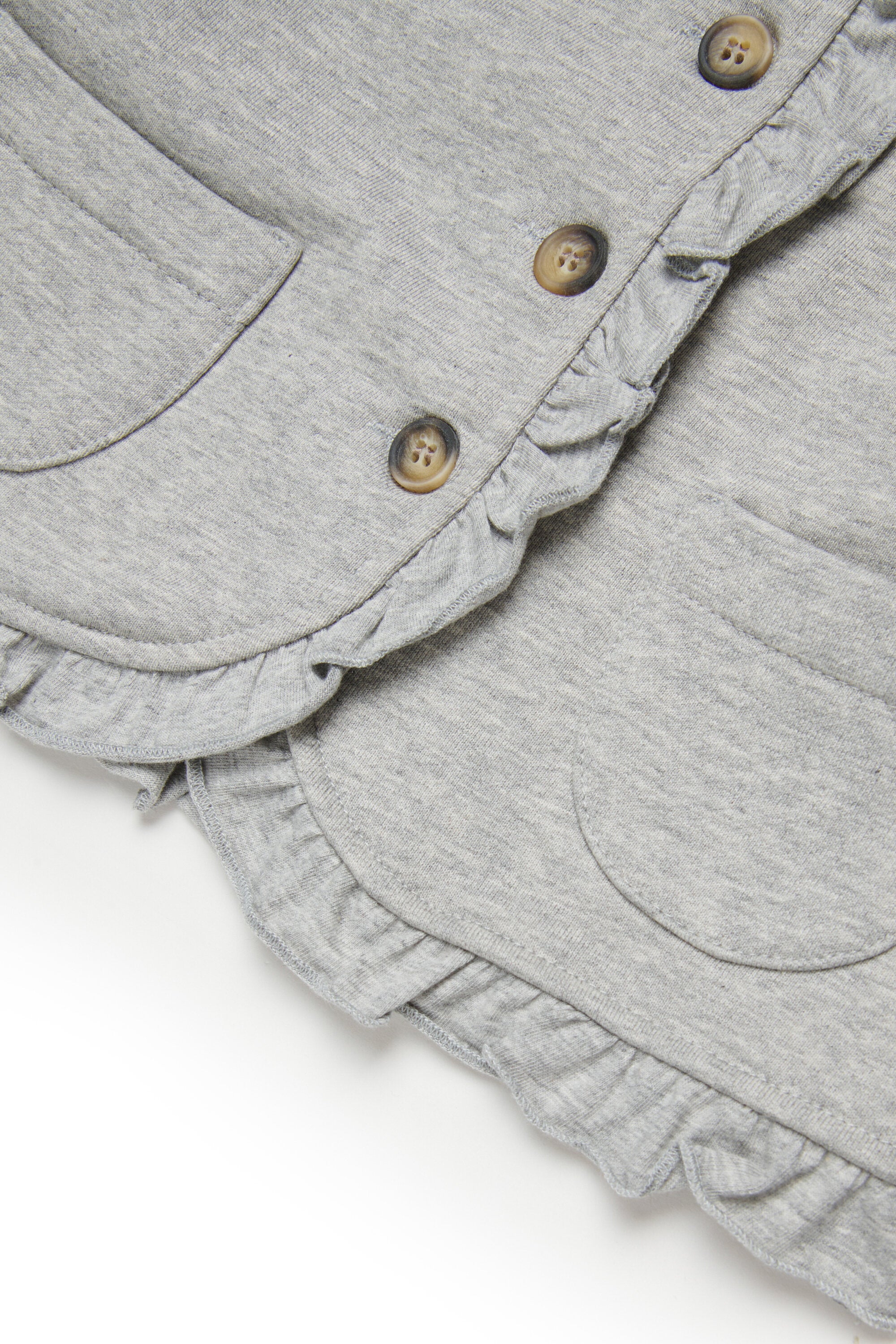 Chaqueta con volantes y logo