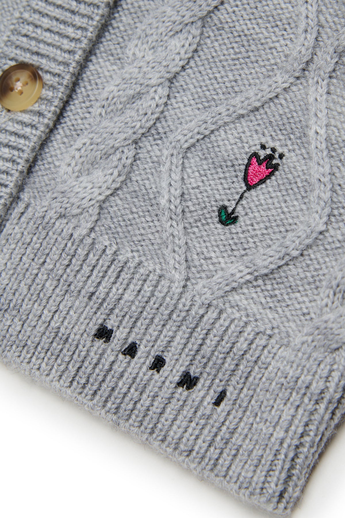 Cardigan con trecce e ricami floreali