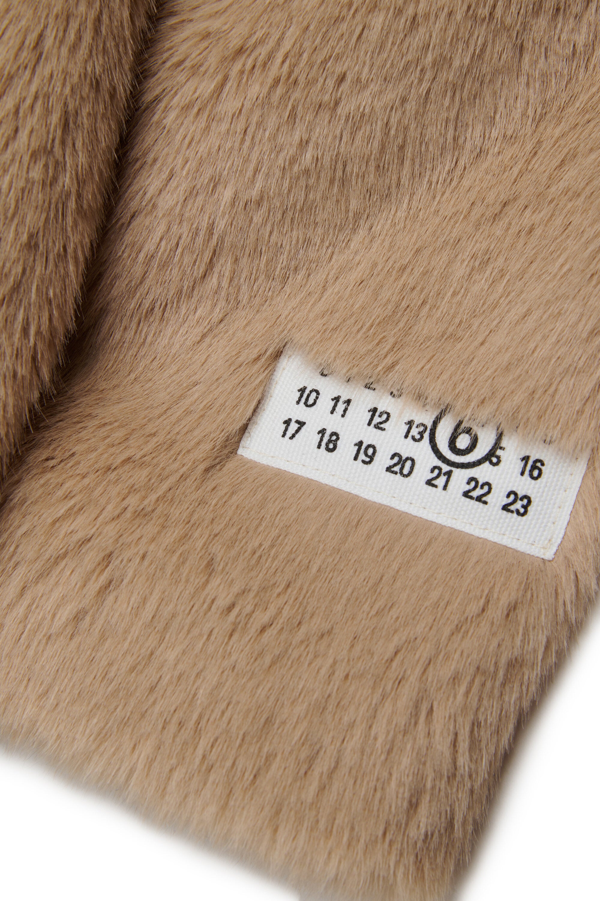 Veste en fausse fourrure avec logo