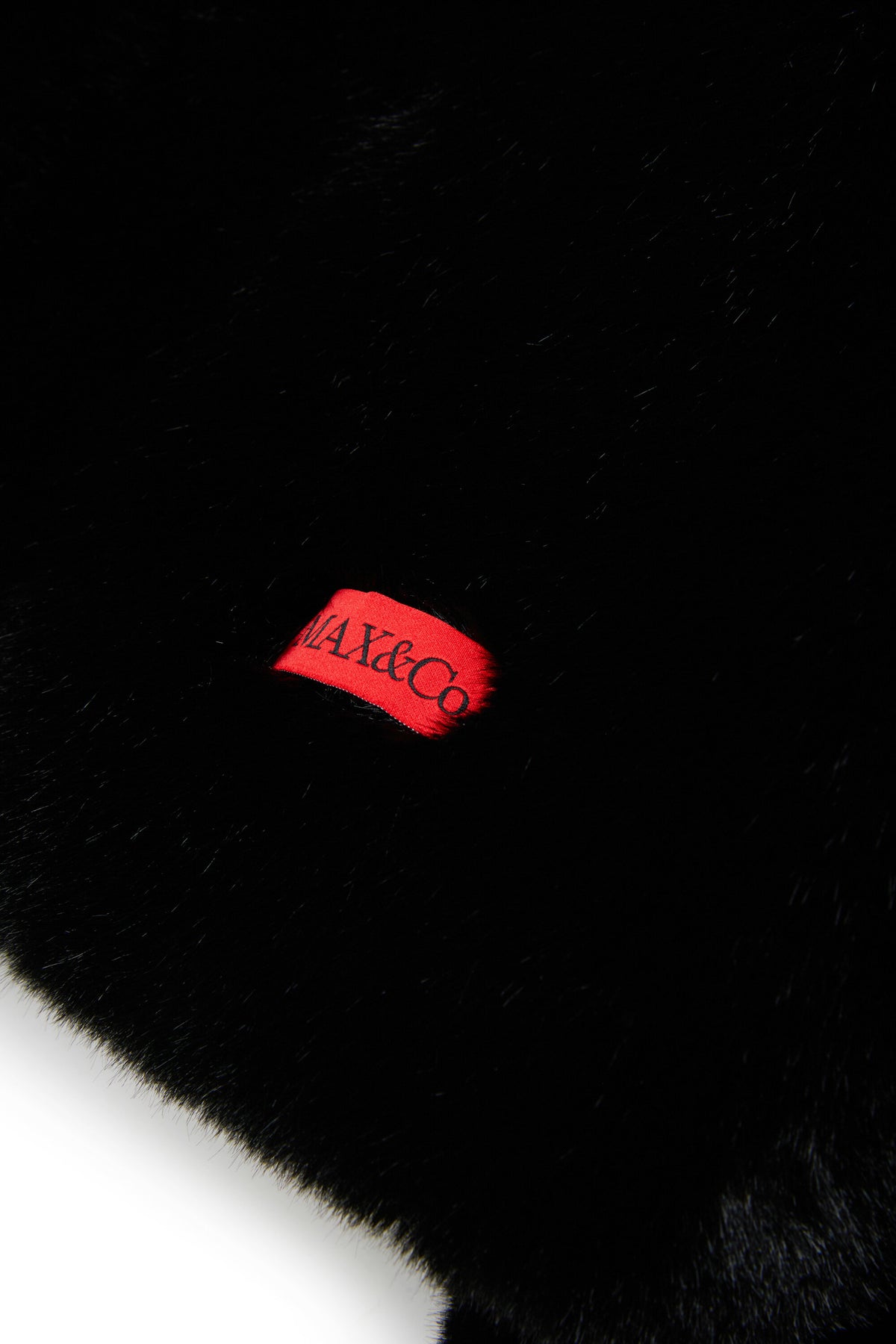Veste en fausse fourrure avec logo