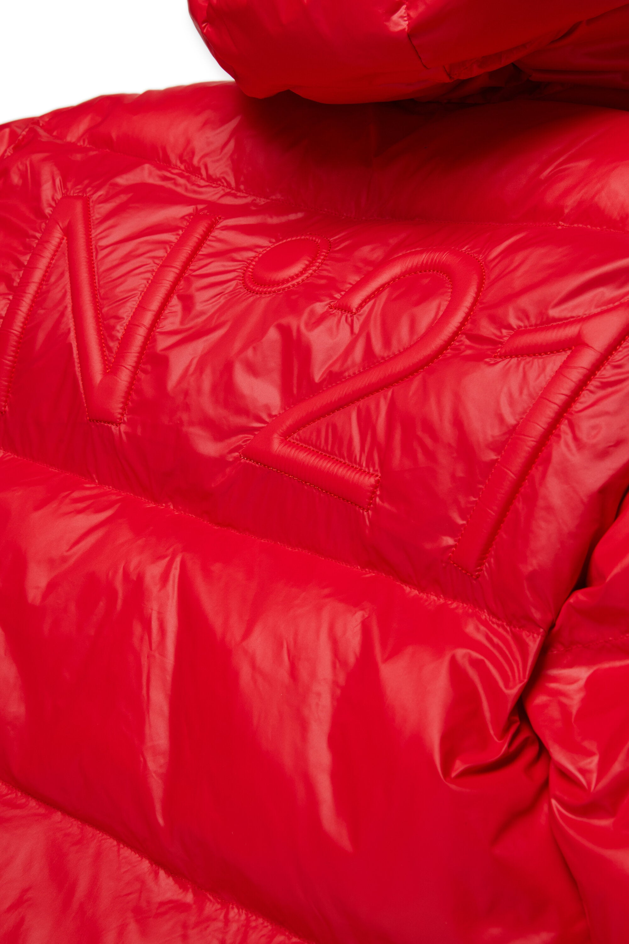 Veste courte et matelassée à fond asymétrique