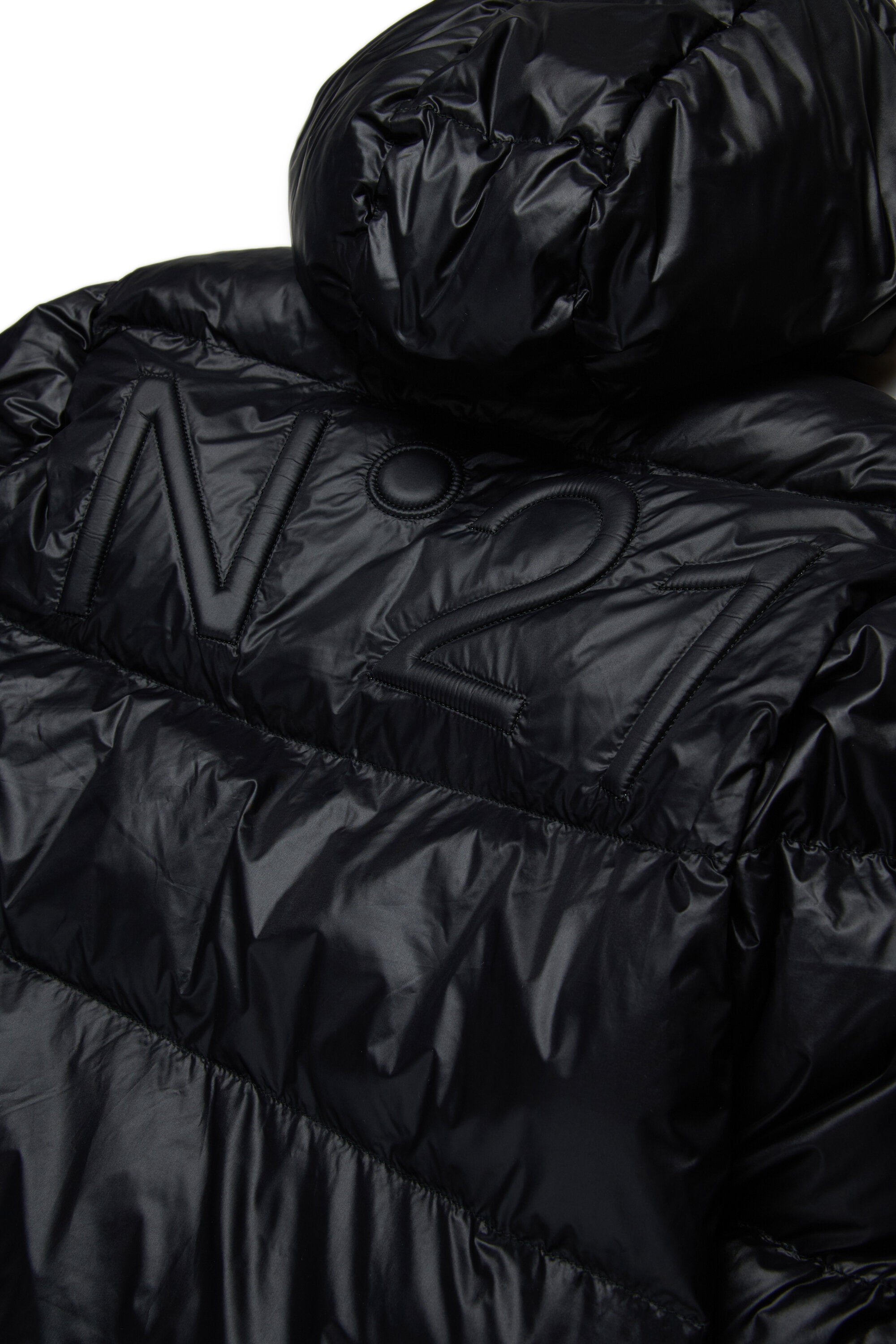 Veste courte et matelassée à fond asymétrique