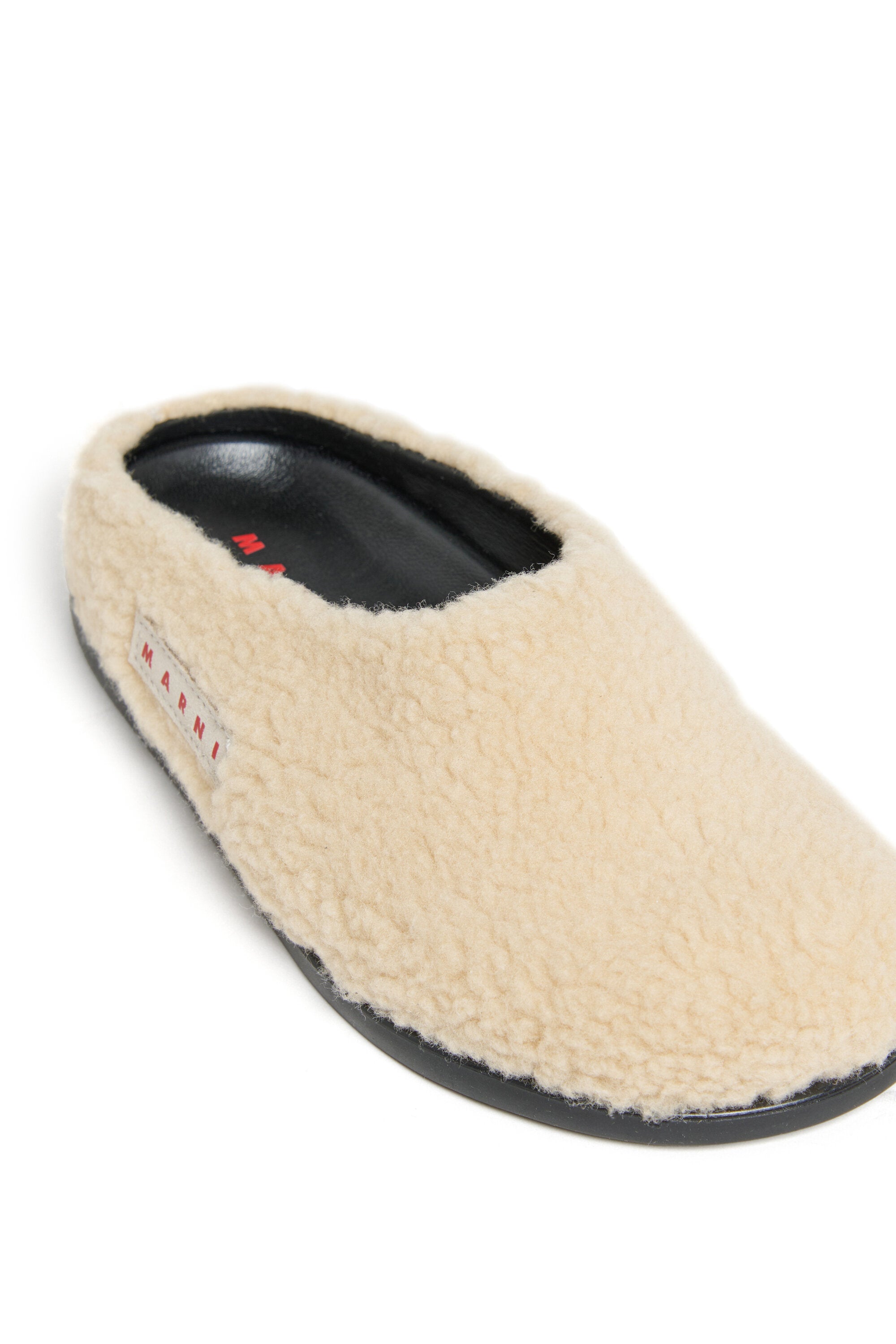 Ciabatte mules in teddy con logo