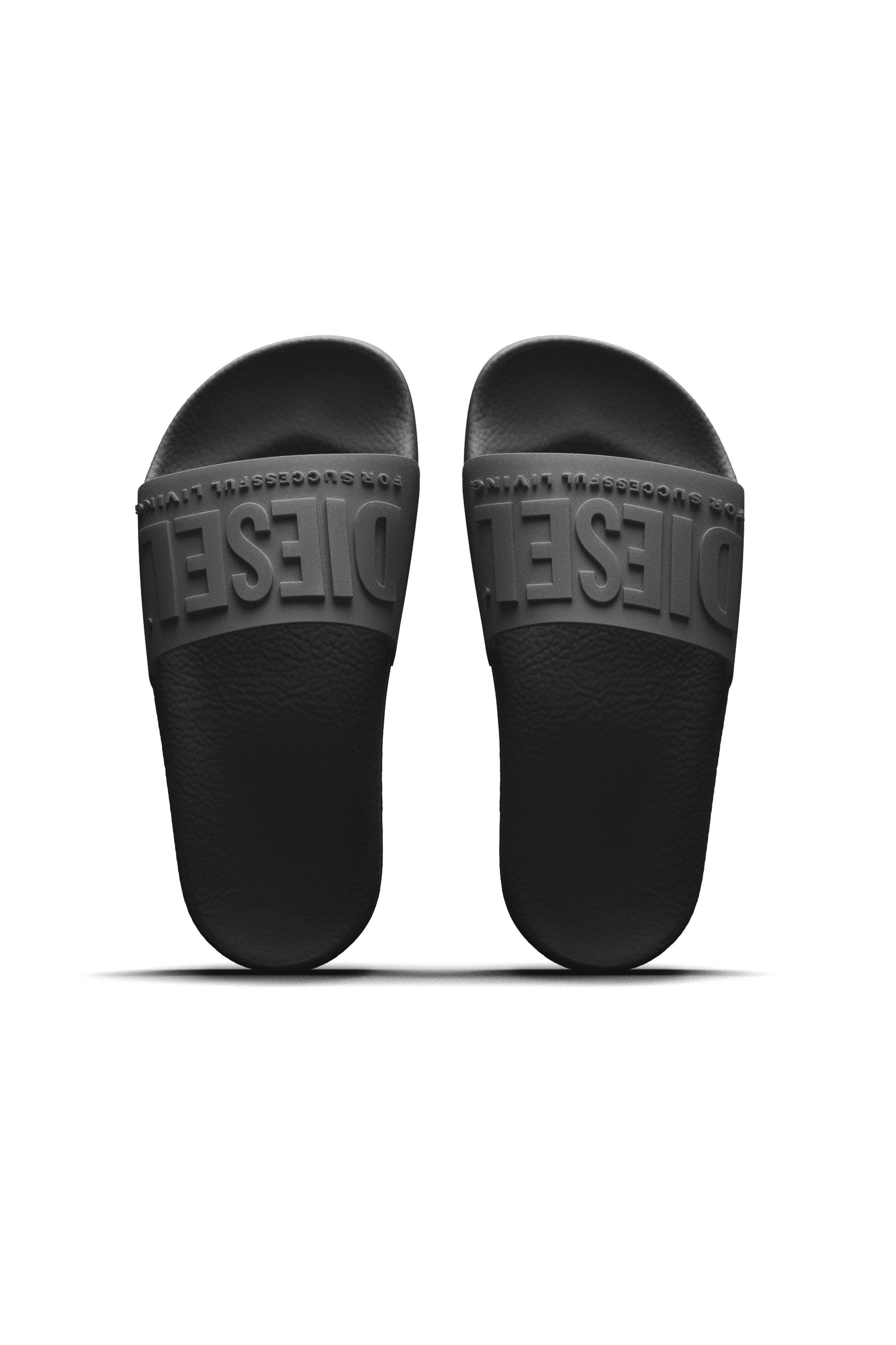 Black Mayemi slide slippers with embossed logo