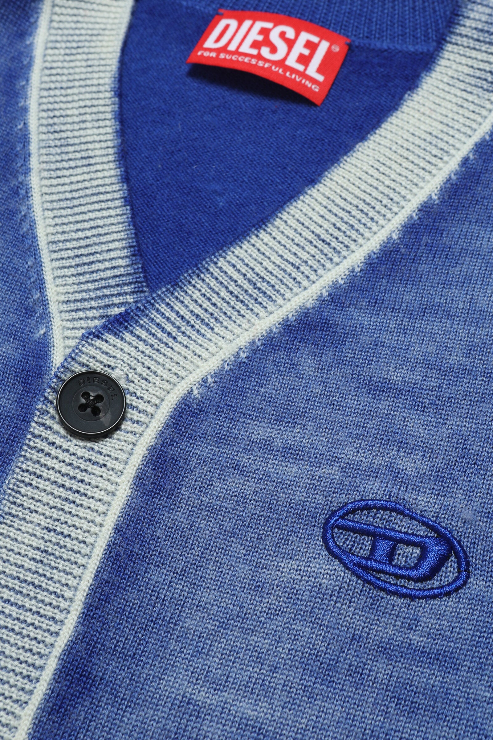 Merino wool cardigan with delavé effect and Oval D logo