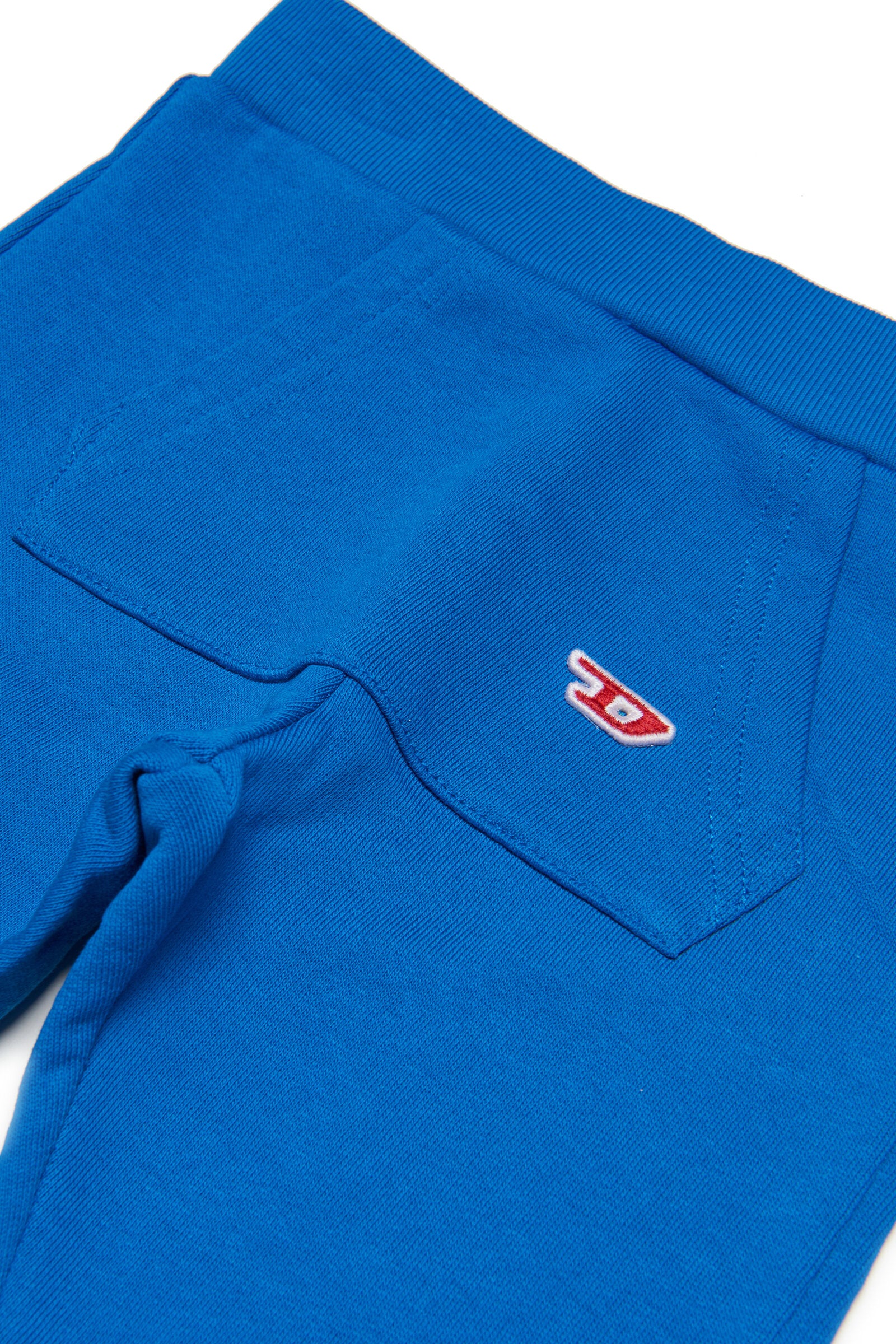 Blue sweatshirt pants with D logo