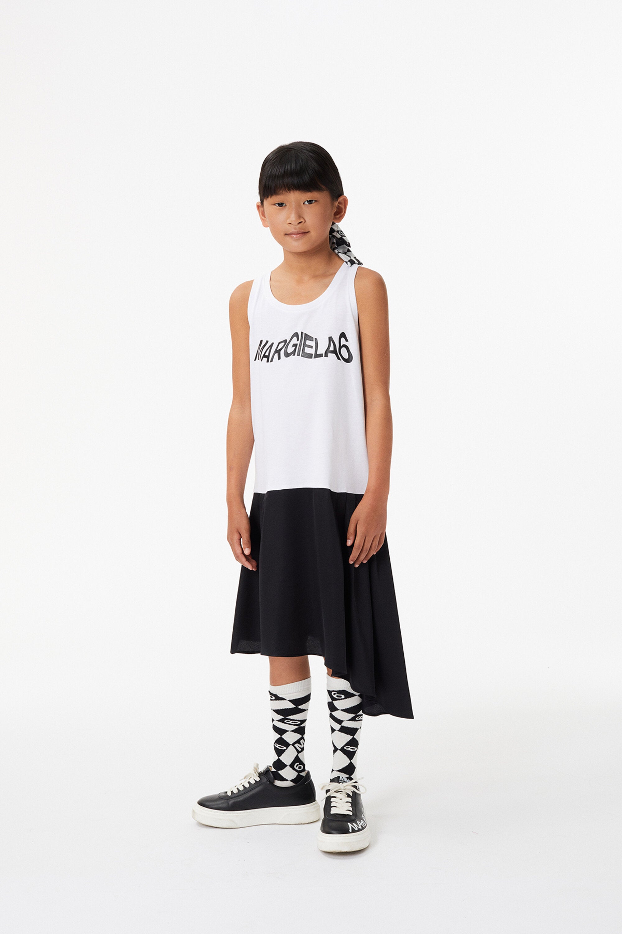 Black and white sleeveless jersey dress with asymmetric skirt and logo