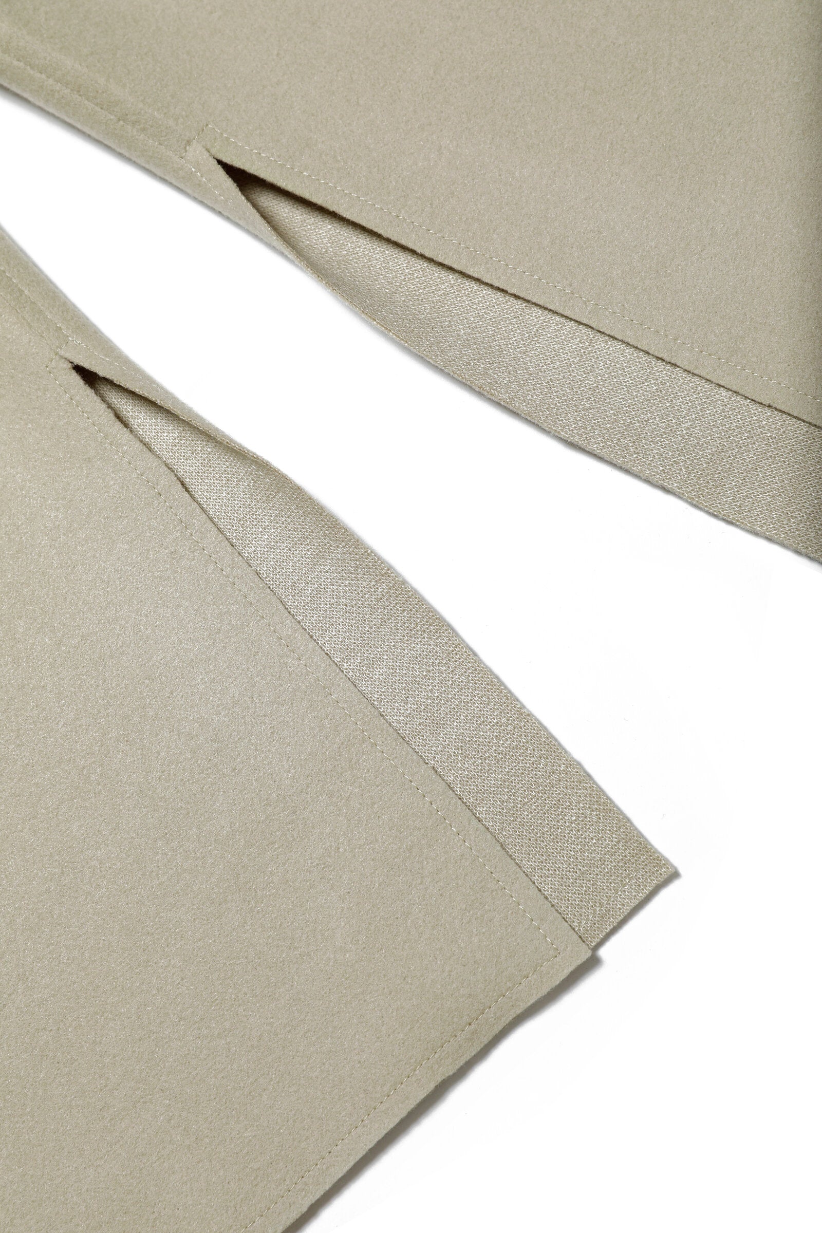 Cloth palazzo pants with raw-cut slits inside the bottom leg