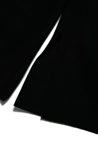 Pantalones palazzo de tela con aberturas de corte en crudo en el interior del bajo de la pierna